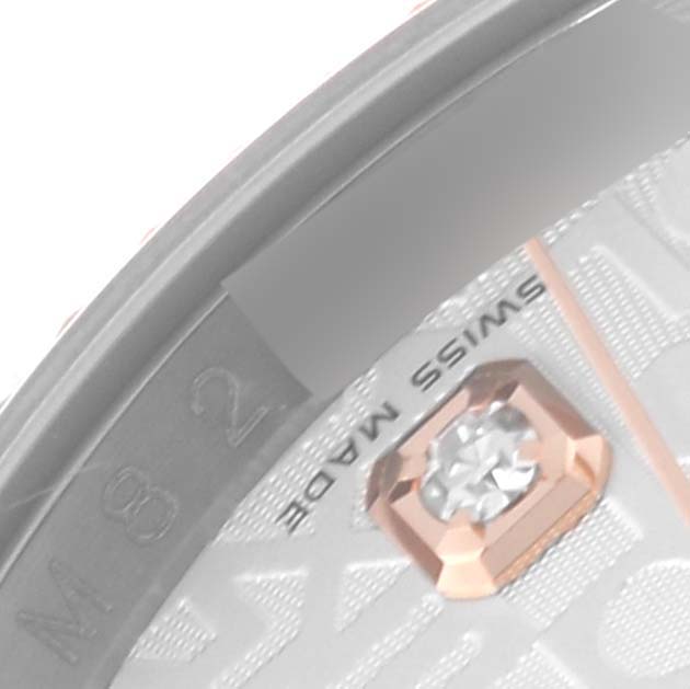 The close-up image shows a portion of the dial and bezel of a Rolex Datejust 116231 Men's Steel and Gold (two tone) Silver Dial 116231 Men's Steel and Gold (two tone) Silver Dial, highlighting a gemstone marker and "SWISS MADE" text.