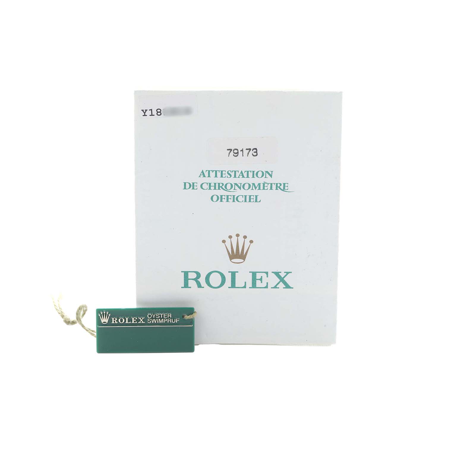 The image shows a Rolex Datejust 79173 Women
s Steel and Gold (two tone) Champagne Dial warranty card and tag, emphasizing accessories rather than the watch itself.