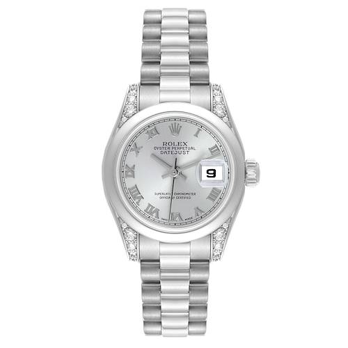 The Rolex President watch is shown from a top-down angle, featuring the dial, bracelet, and diamond-accented lugs.