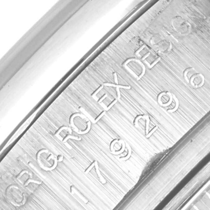 The image shows the engraved side of the Rolex President 179296 Women's Platinum Silver Dial 179296 Women's Platinum Silver Dial watch case at a close angle, displaying the brand and model details.