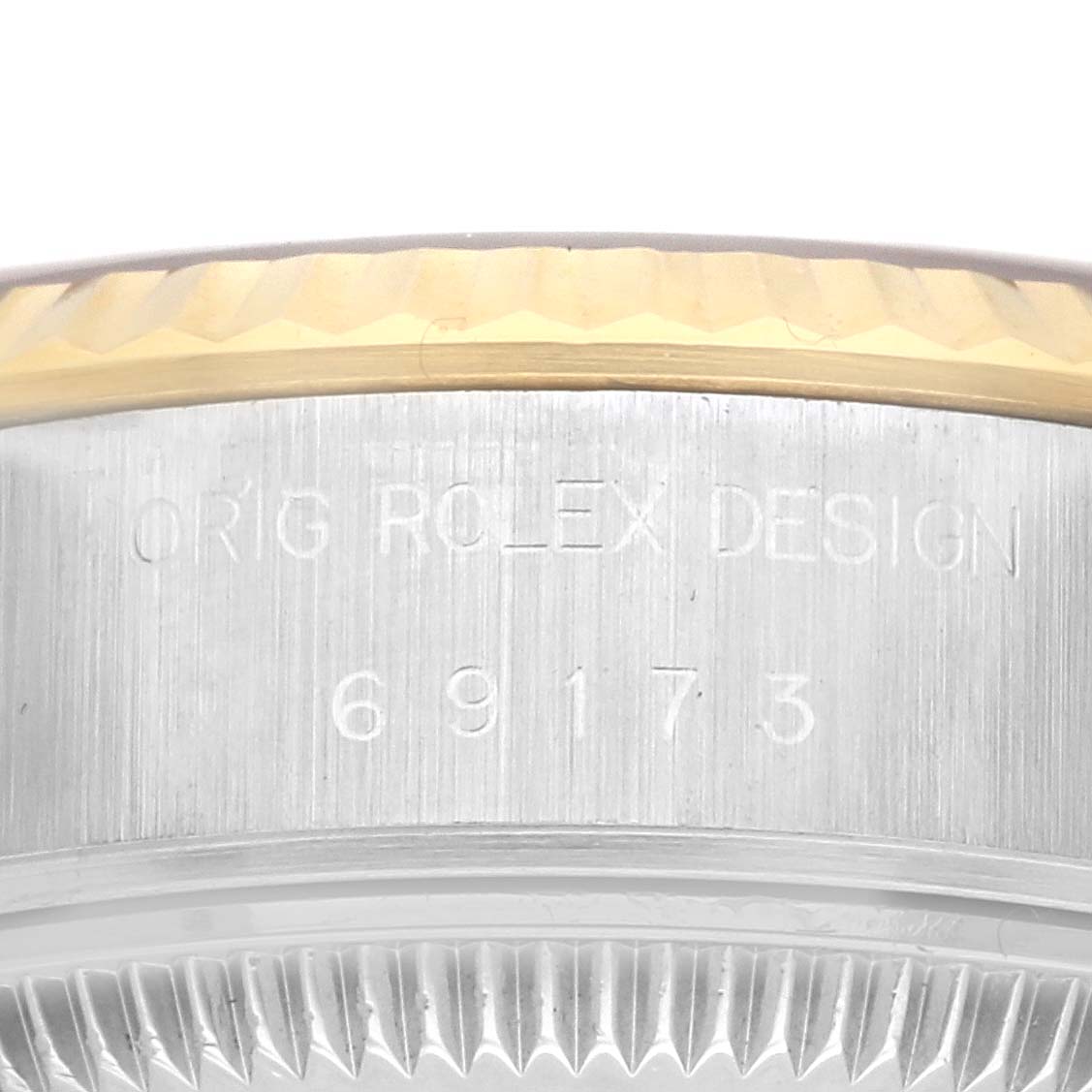 This image shows a close-up of the side case and bezel of a Rolex Datejust 69173 Women
s Steel and Gold (two tone) Champagne Dial 69173 Women
s Steel and Gold (two tone) Champagne Dial watch, highlighting the model number 69173.