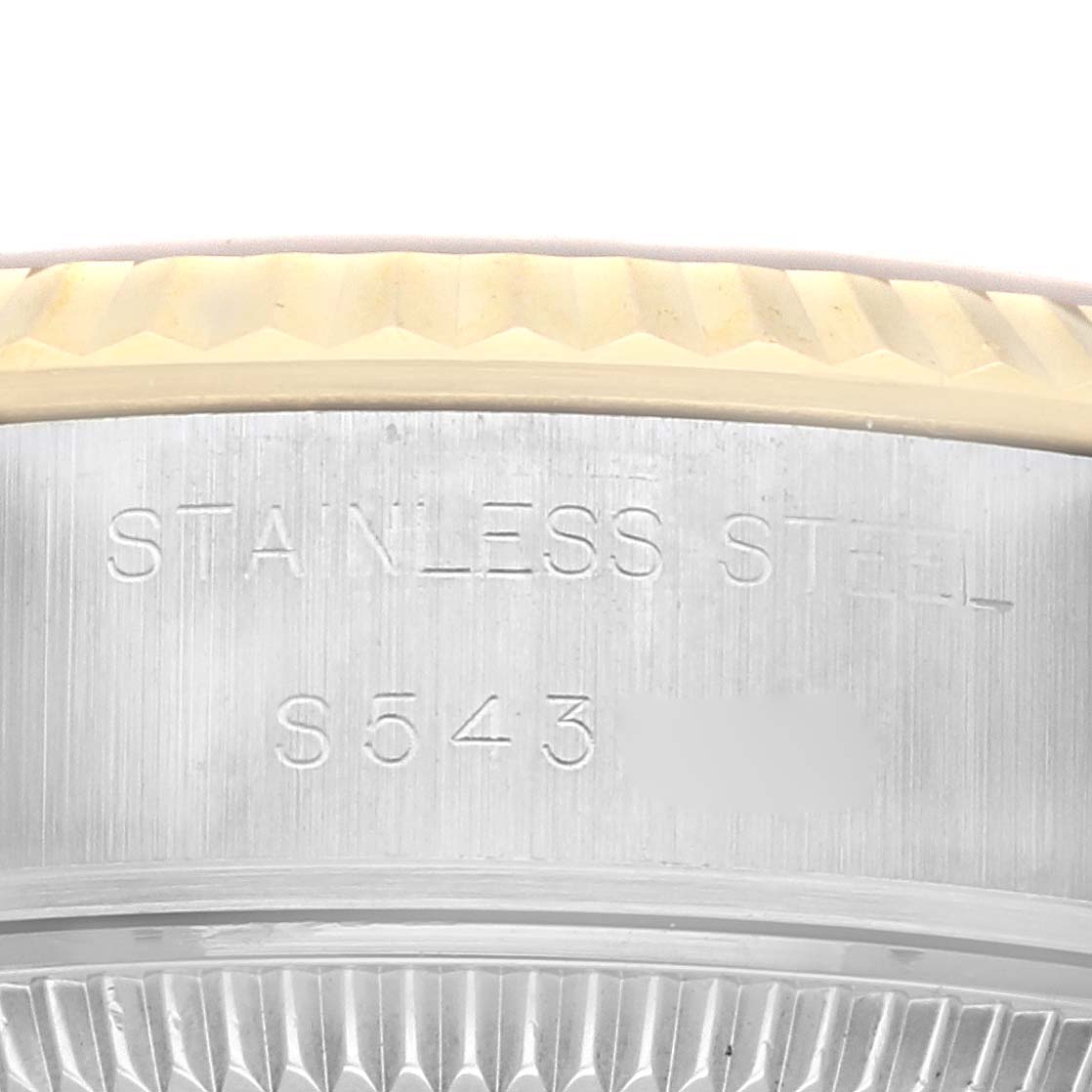 This close-up shows the engravings on the stainless steel body of a Rolex Datejust 69173 Women
s Steel and Gold (two tone) Champagne Dial 69173 Women
s Steel and Gold (two tone) Champagne Dial watch, including the model number.