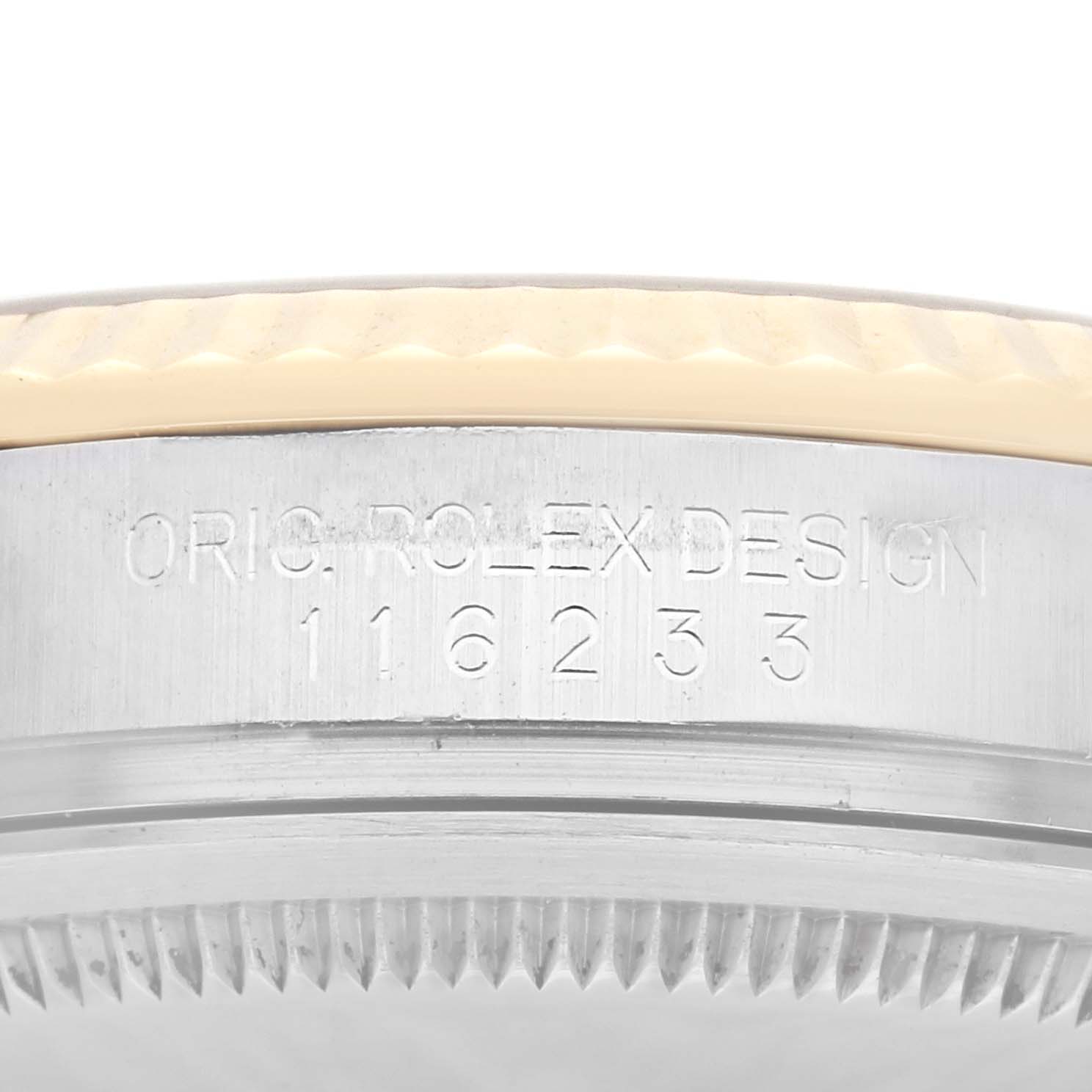 The image shows a side view of the case of a Rolex Datejust 116233 Men
s Steel and Gold (two tone) Champagne Dial 116233 Men
s Steel and Gold (two tone) Champagne Dial 41, highlighting the engravings on the side.