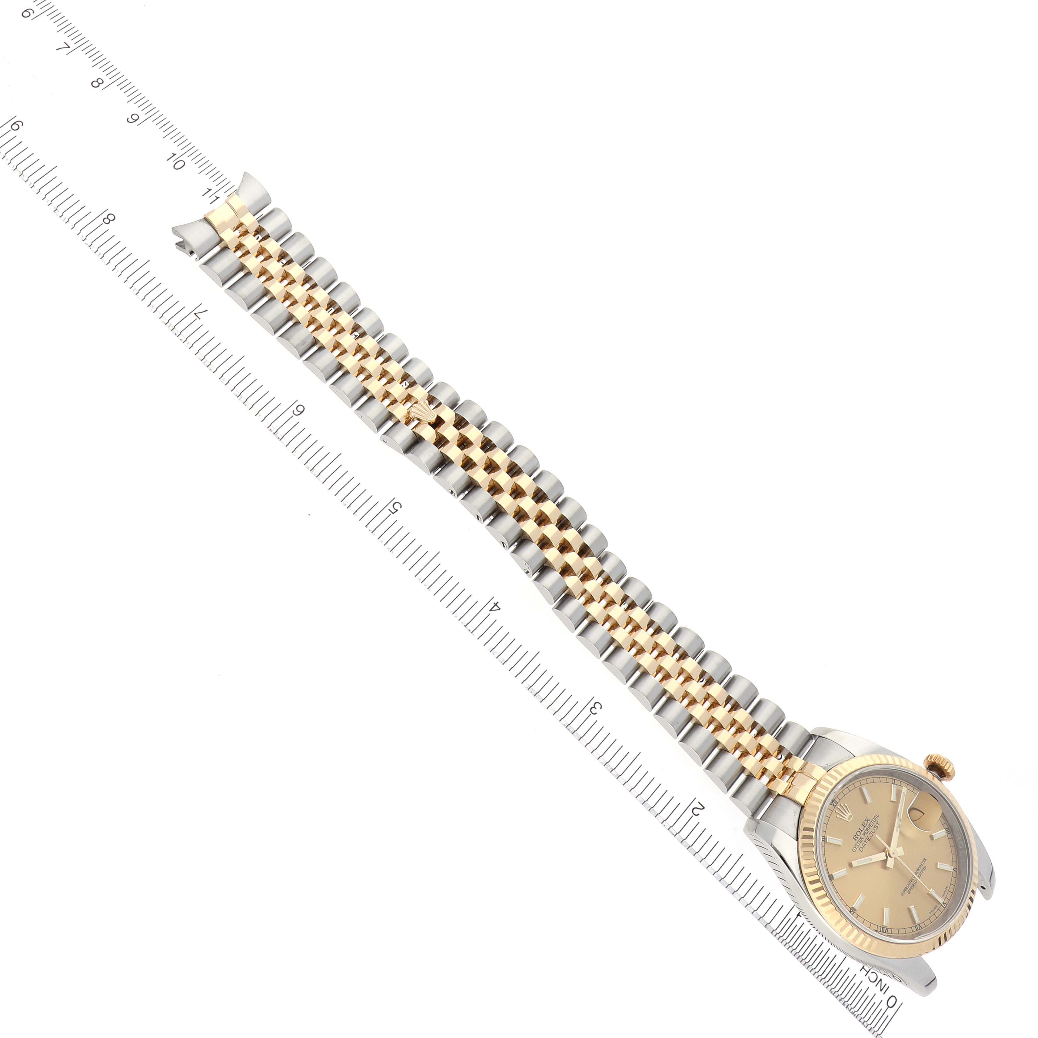 The image shows a Rolex Datejust 116233 Men
s Steel and Gold (two tone) Champagne Dial 116233 Men
s Steel and Gold (two tone) Champagne Dial 41 watch angled diagonally, displaying the dial, bezel, and full bracelet with a ruler for scale.