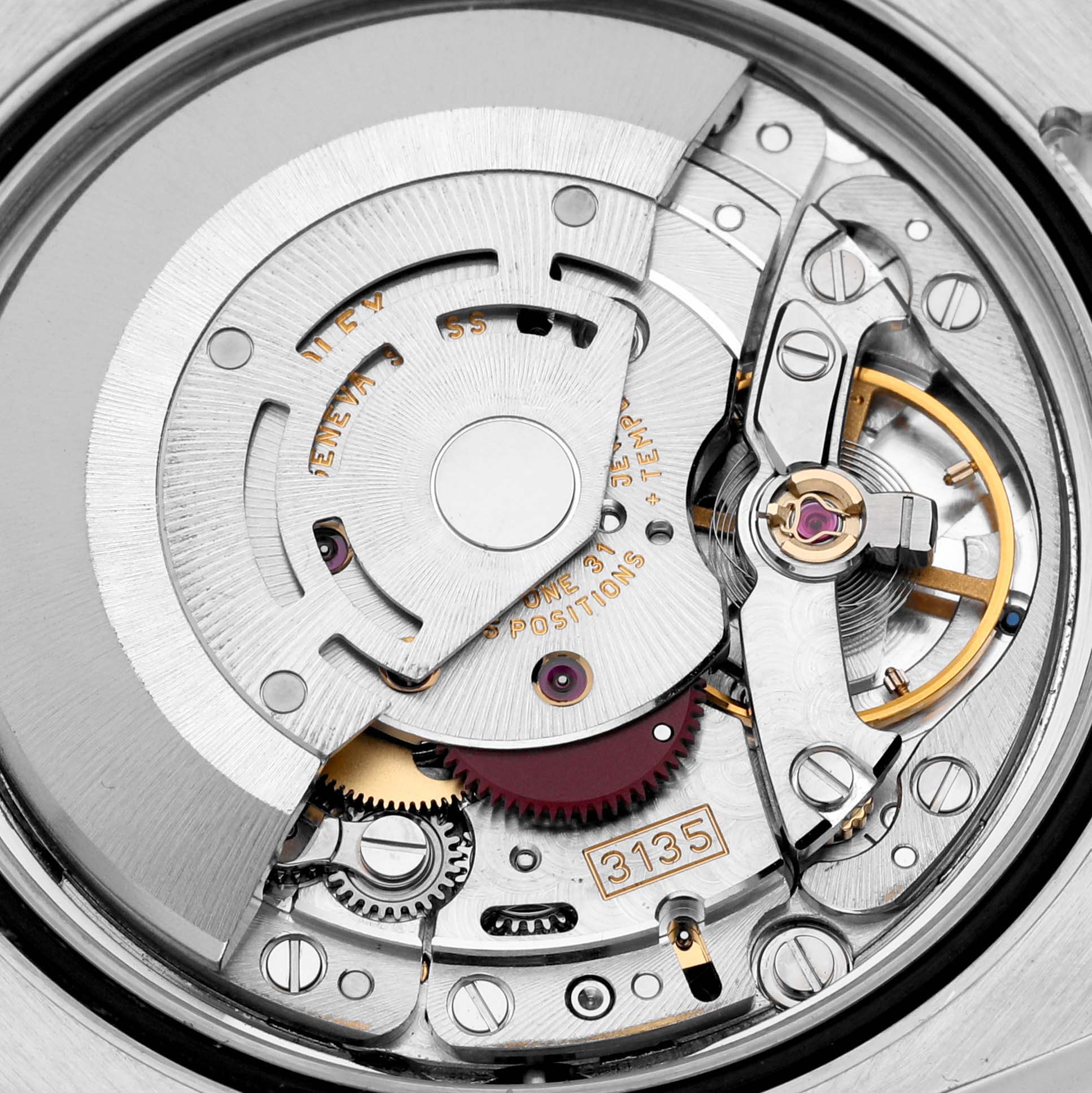 This image shows the intricate inner mechanism and components of the Rolex Datejust 116233 Men's Steel and Gold (two tone) White Dial 116233 Men's Steel and Gold (two tone) White Dial watch, including gears and the balance wheel.
