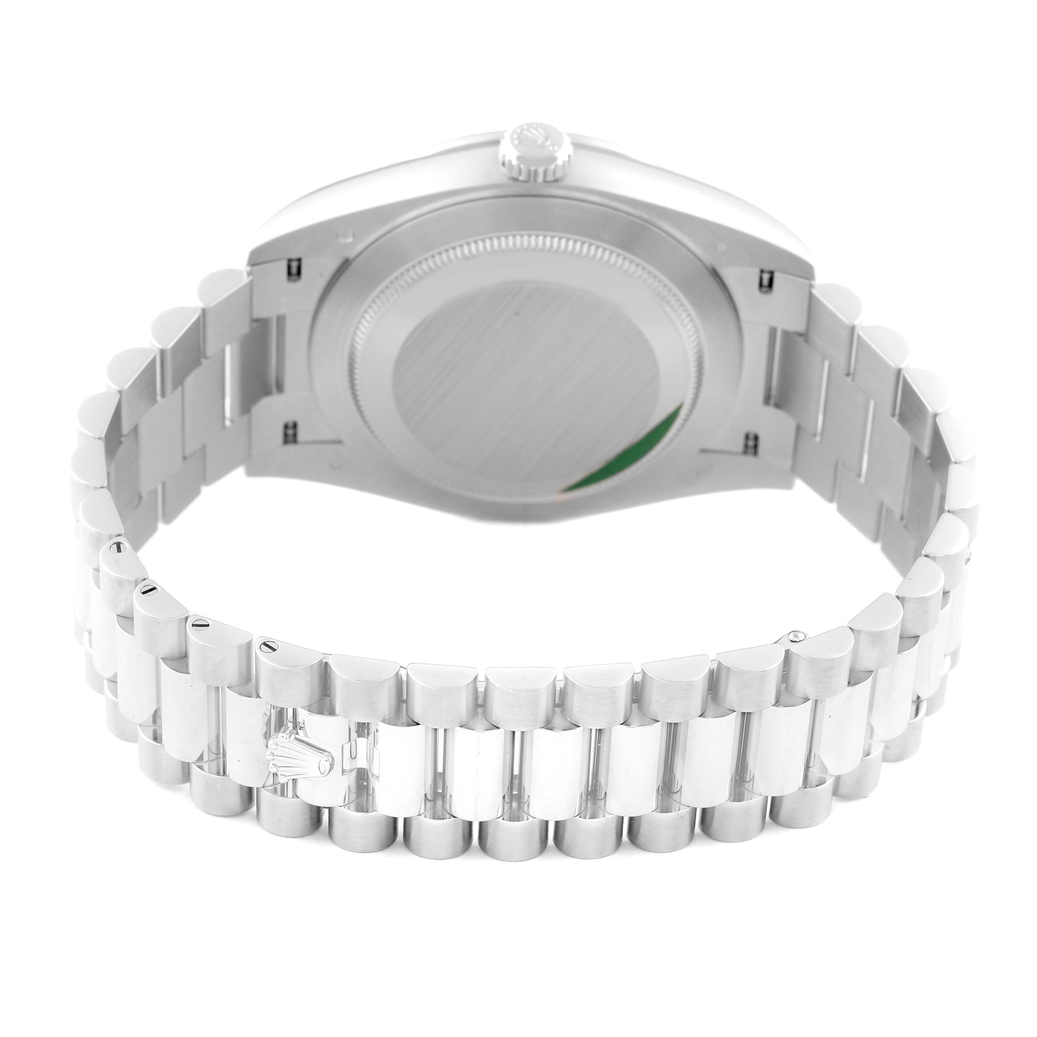 The image shows the back view of a Rolex President 228396TBR Men's Platinum Silver Dial 228396TBR Men's Platinum Silver Dial model watch, highlighting the case back and bracelet.