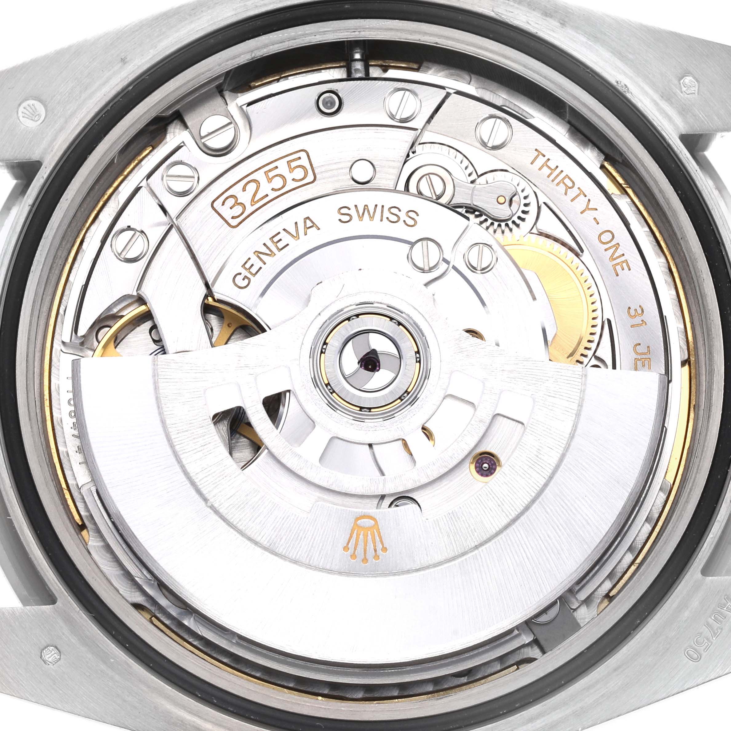 The image shows the movement of the Rolex President 228349RBR Men's White Gold Blue Dial 228349RBR Men's White Gold Blue Dial model, focusing on the rotor and intricate mechanisms.