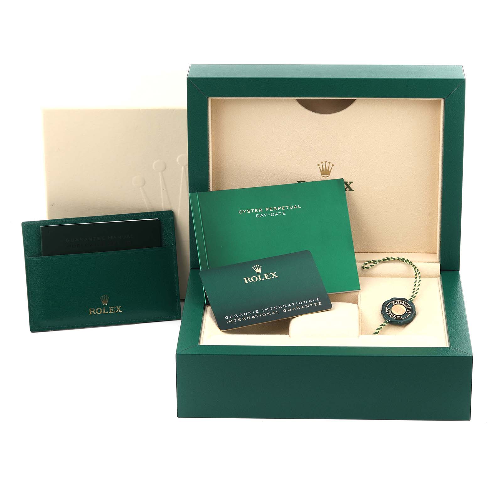 This image shows the packaging, warranty cards, booklet, and tag of the Rolex President 228349RBR Men's White Gold Blue Dial 228349RBR Men's White Gold Blue Dial model watch.