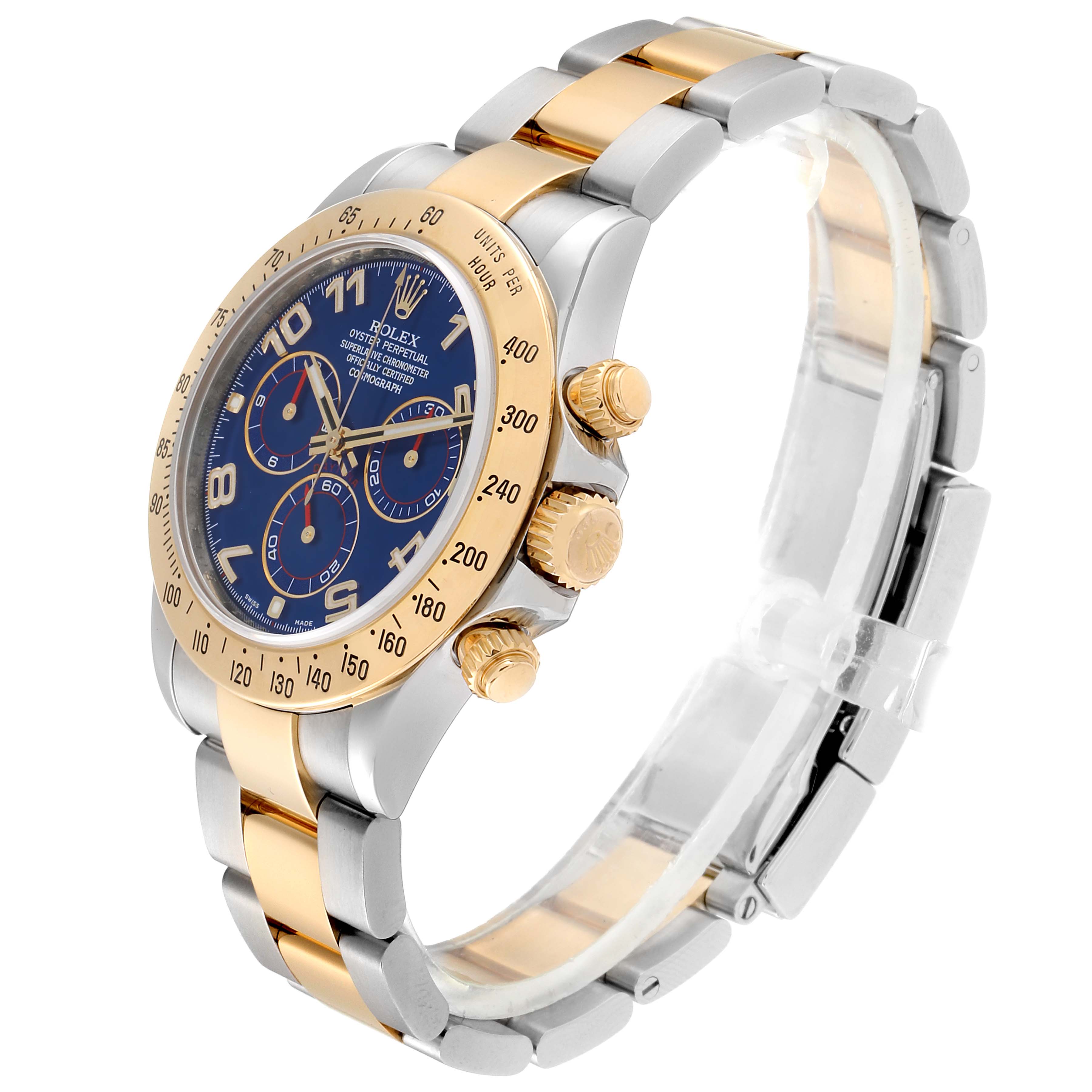 The Rolex Daytona 116523 Men's Steel and Gold (two tone) Blue Dial 116523 Men's Steel and Gold (two tone) Blue Dial watch is shown at a slight angle, displaying its gold and silver bracelet, blue dial, and three sub-dials on the face.