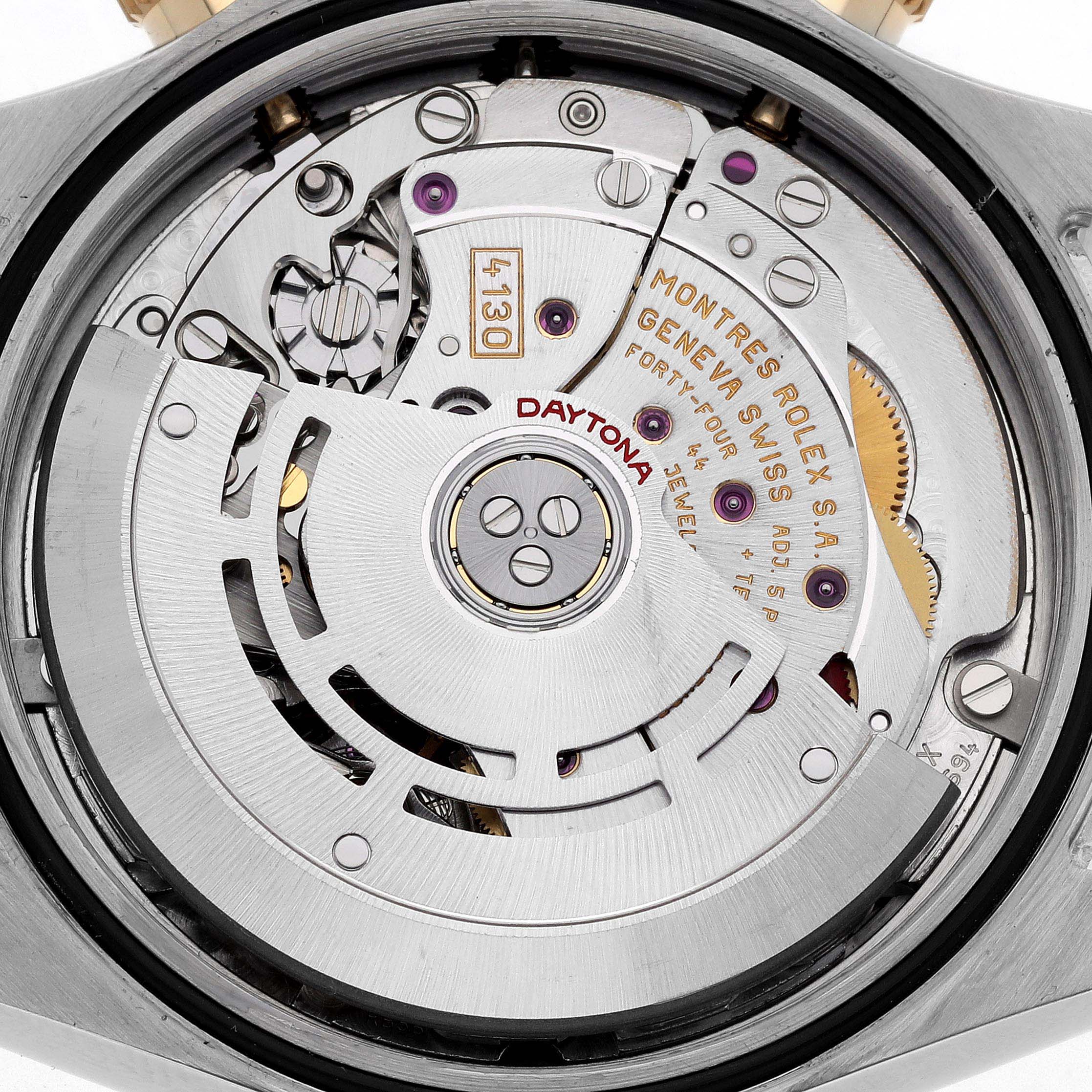 The image shows a close-up of the movement of a Rolex Daytona 116523 Men
s Steel and Gold (two tone) Mother of Pearl Dial watch.