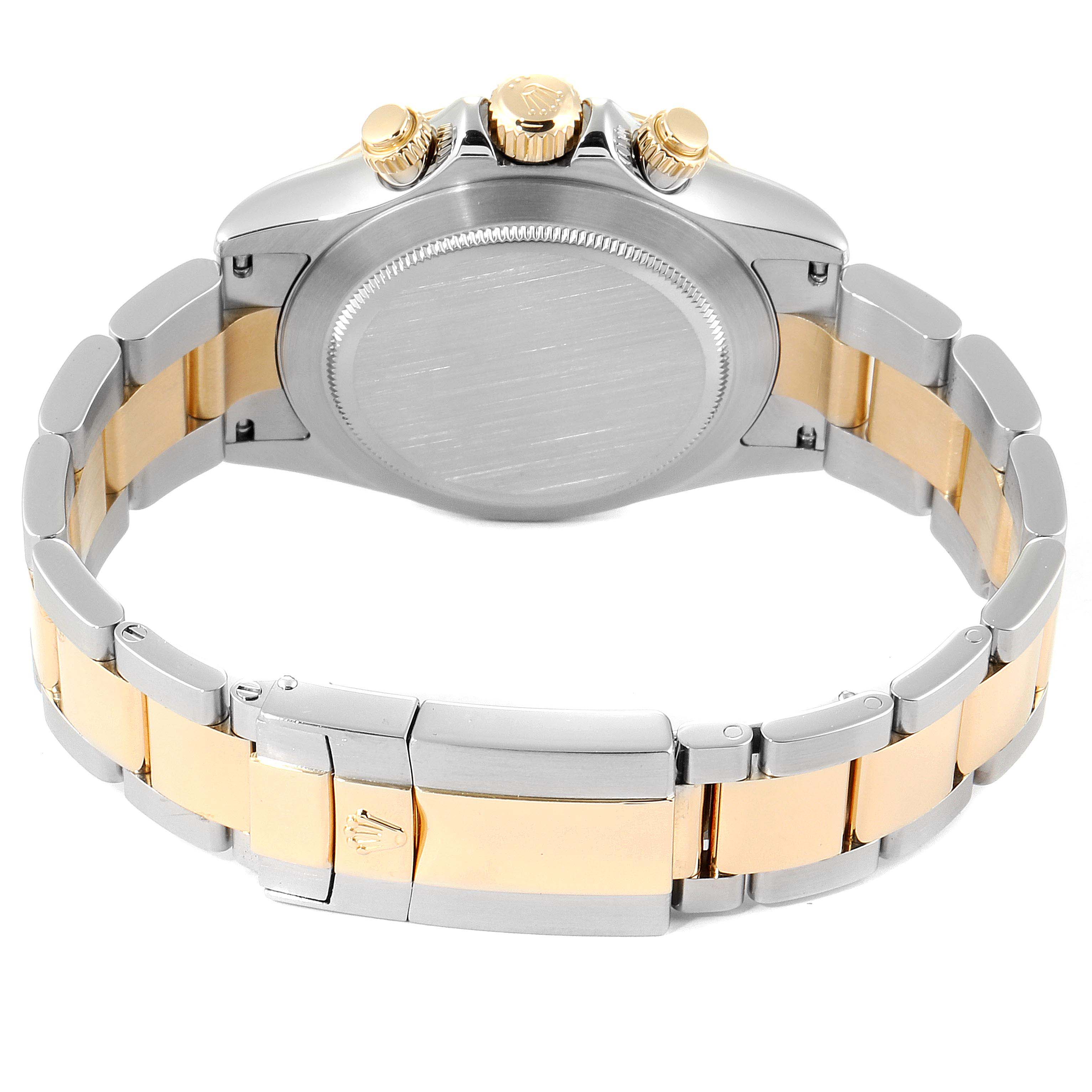 This image shows the back view of a Rolex Daytona 116523 Men's Steel and Gold (two tone) Mother of Pearl Dial 116523 Men's Steel and Gold (two tone) Mother of Pearl Dial watch, highlighting the case back, bracelet, and clasp.