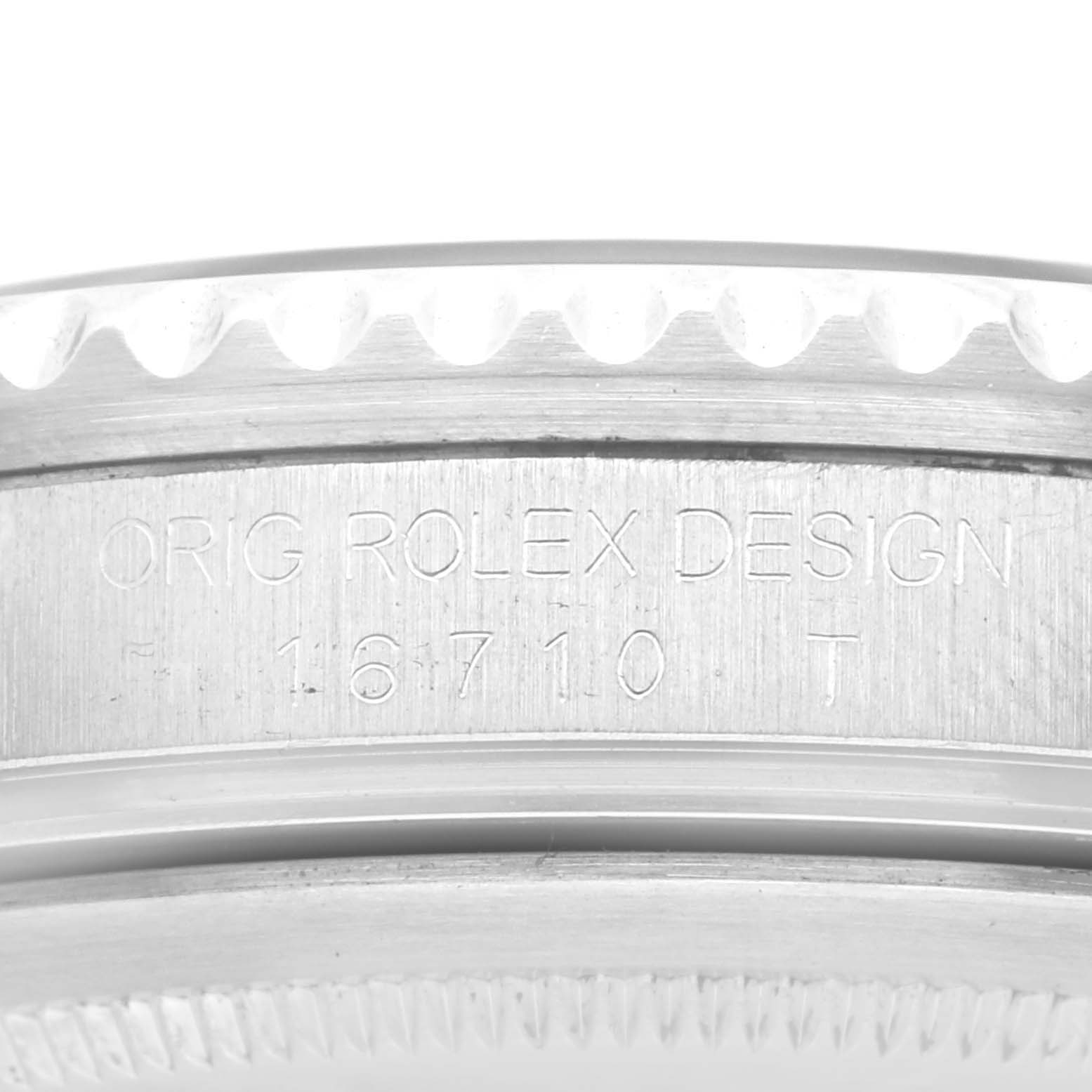 The image shows a close-up angle of the case side and bezel of a Rolex GMT-Master 16710 Men's Stainless Steel Black Dial 16710 Men's Stainless Steel Black Dial watch, highlighting the engraved text.