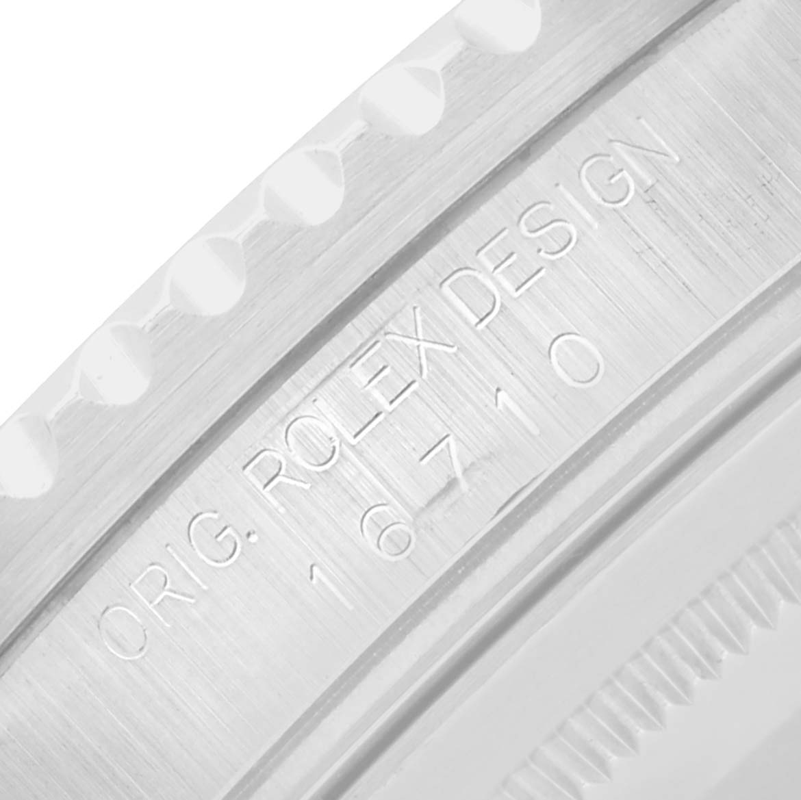 The image shows a close-up of the engraved writing on the case side of a Rolex GMT-Master 16710 Men
s Stainless Steel Black Dial, model number 16710.