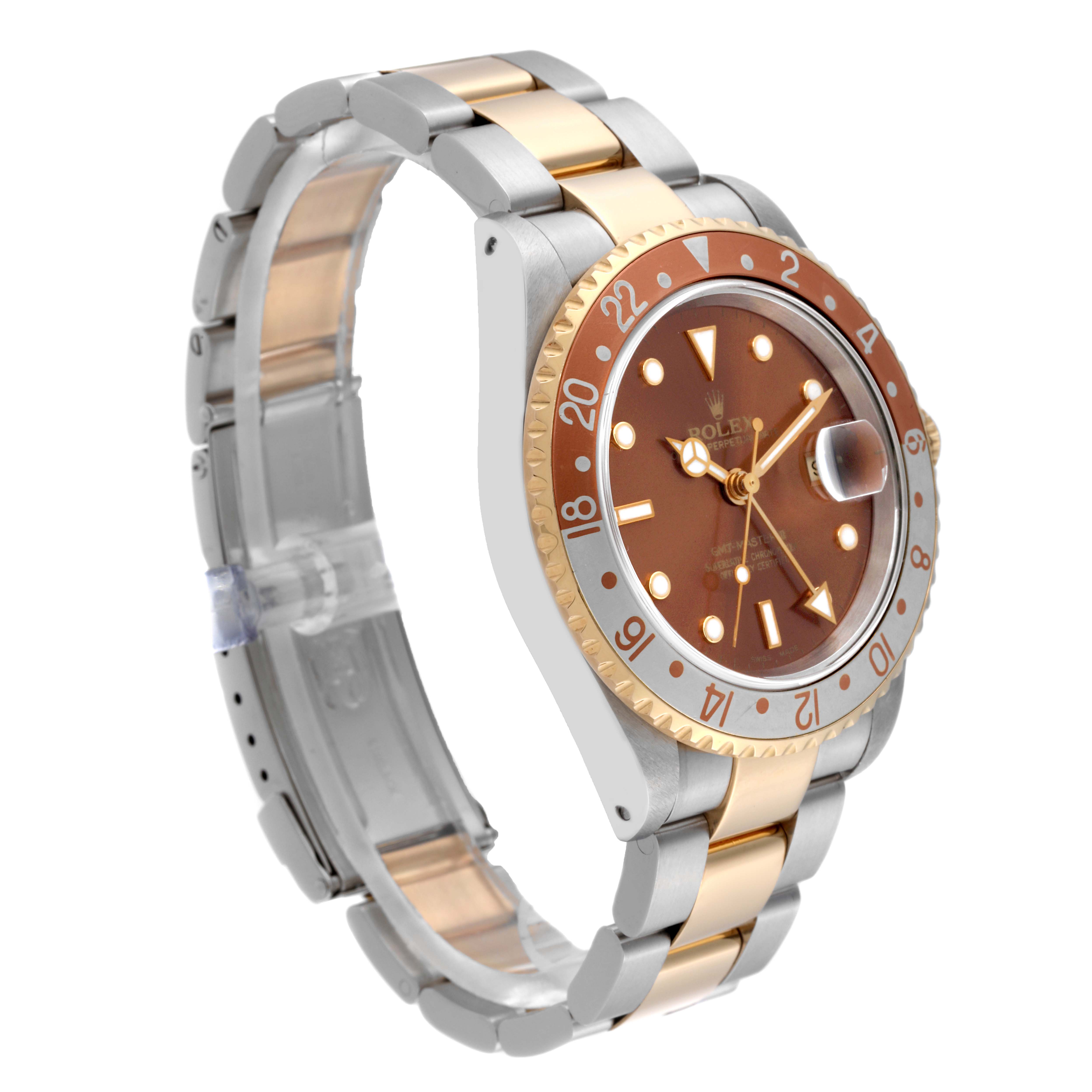 The Rolex GMT-Master 16713 Men's Steel and Gold (two tone) Brown Dial 16713 Men's Steel and Gold (two tone) Brown Dial is shown at a three-quarter angle, highlighting the dial, bezel, and two-tone bracelet.