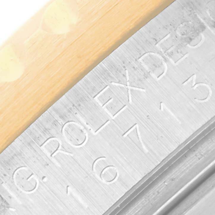 The image shows a close-up of the GMT-Master Rolex's side, highlighting part of the bezel and engraved design details.