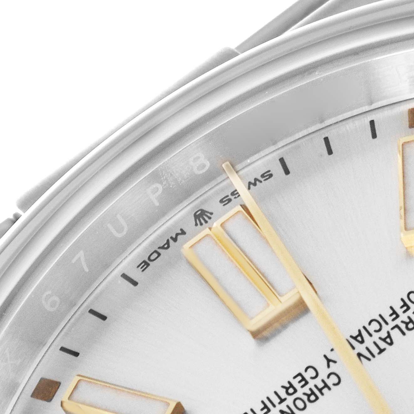 The image shows a close-up of the dial of a Rolex Oyster Perpetual 124300 Men's Stainless Steel Silver Dial 124300 Men's Stainless Steel Silver Dial watch, highlighting the hour markers and part of the minute hand.