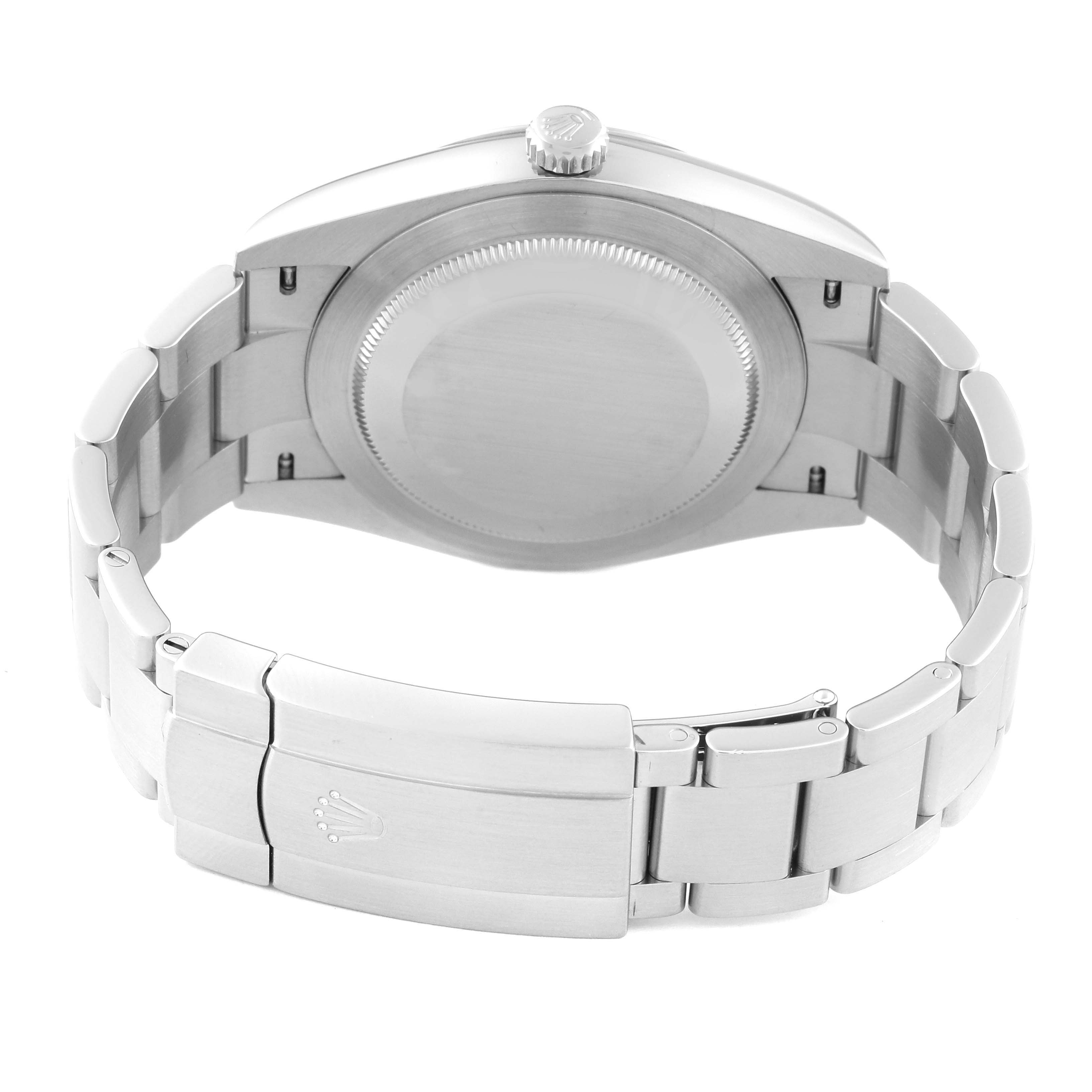 The image shows a rear view of a Rolex Oyster Perpetual 124300 Men's Stainless Steel Silver Dial 124300 Men's Stainless Steel Silver Dial, highlighting the back case and bracelet clasp.