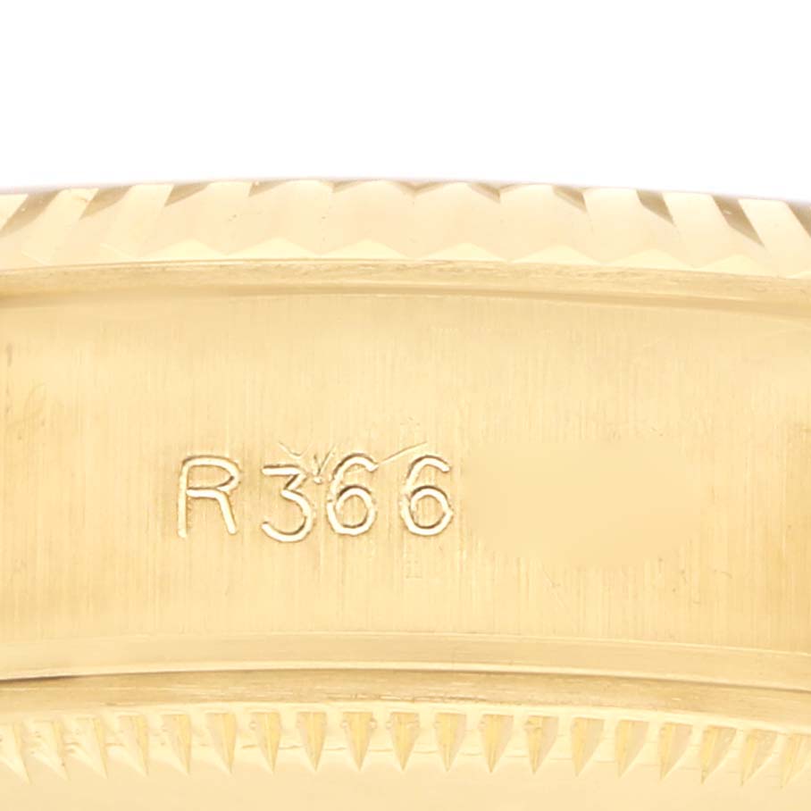 The image shows a close-up of the engraved case side of a Rolex President 69178 Men
s Yellow Gold Champagne Dial watch, highlighting the model number.