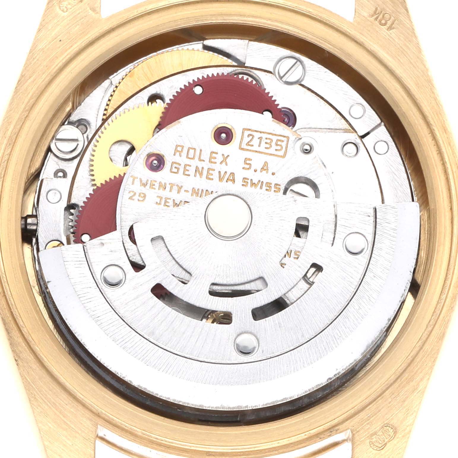 The image shows the movement of a Rolex President 69178 Men
s Yellow Gold Champagne Dial watch, highlighting gears and the rotor from a back angle.