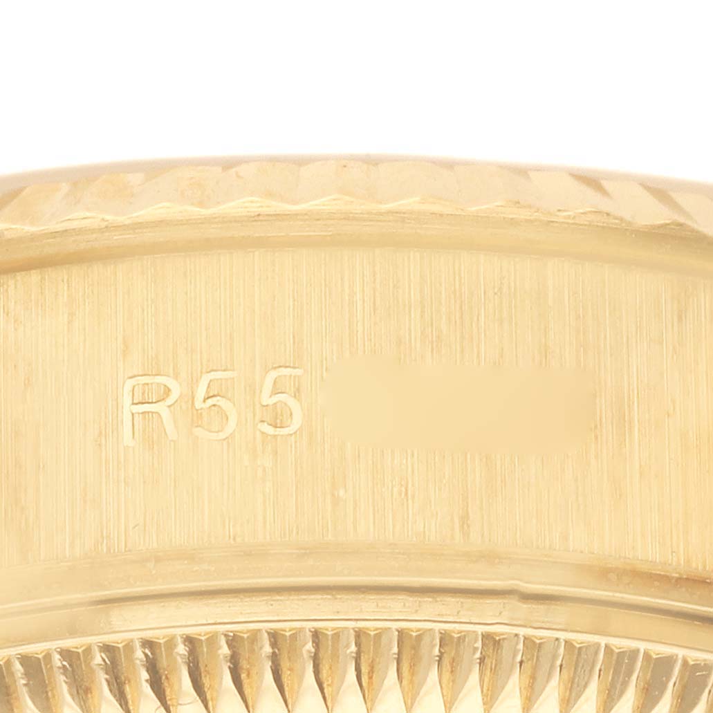 The image shows a close-up of the side bezel and fluted edge of a Rolex President 69178 Women's Yellow Gold Champagne Dial 69178 Women's Yellow Gold Champagne Dial model.