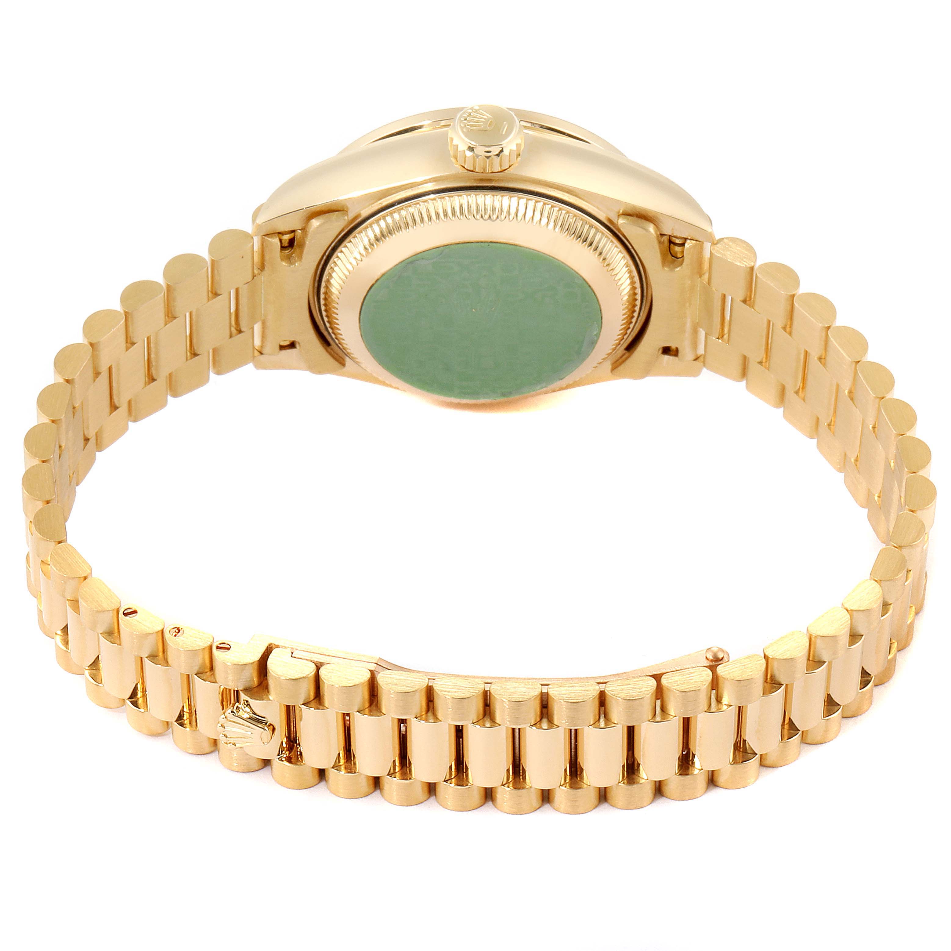 This image shows the back and part of the bracelet of a Rolex President 69138 Women
s Yellow Gold Champagne Dial 69138 Women
s Yellow Gold Champagne Dial model watch, captured from an upward angle.