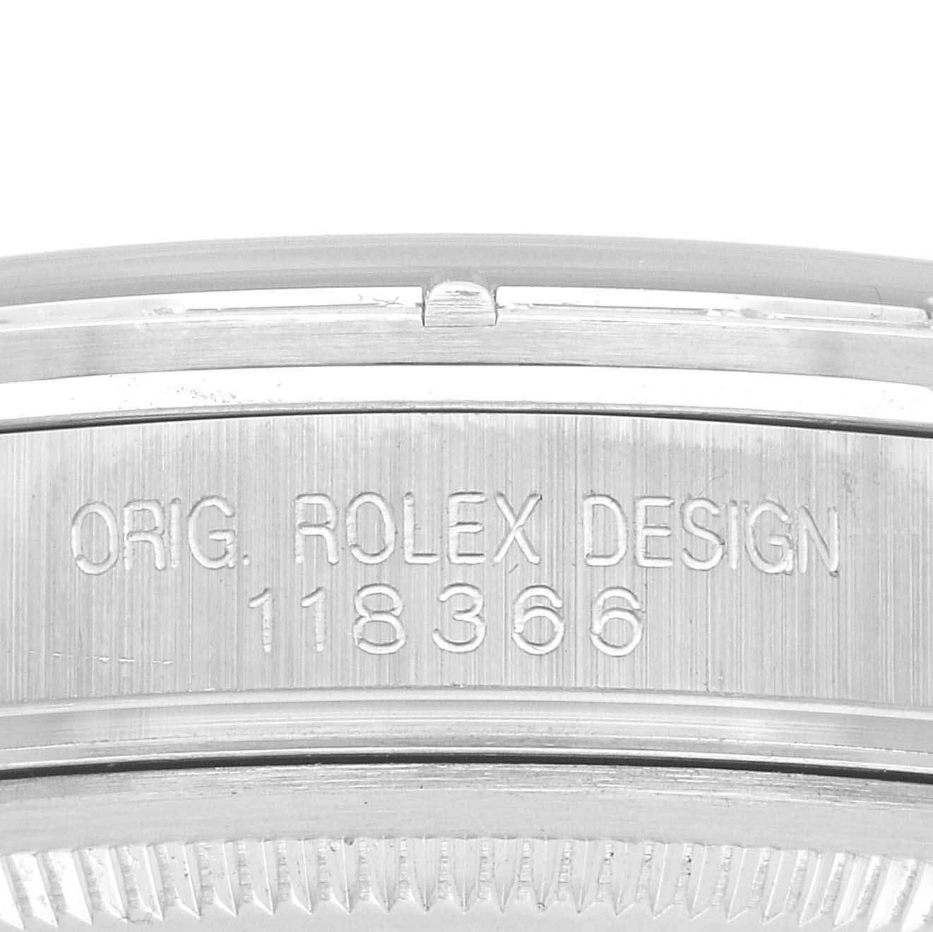 The image shows a close-up of the side engraving on the bezel of a Rolex President 118366 Men
s Platinum Blue Dial model watch.