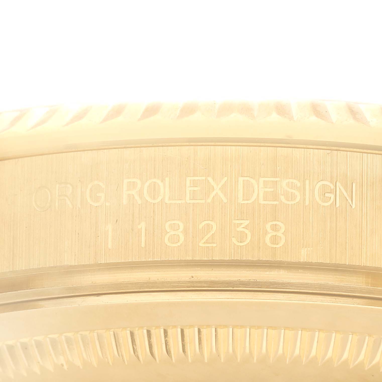 This image shows the engraved inner bezel and serial number on the side of a Rolex President 118238 Men
s Yellow Gold Silver Dial 118238 Men
s Yellow Gold Silver Dial watch.