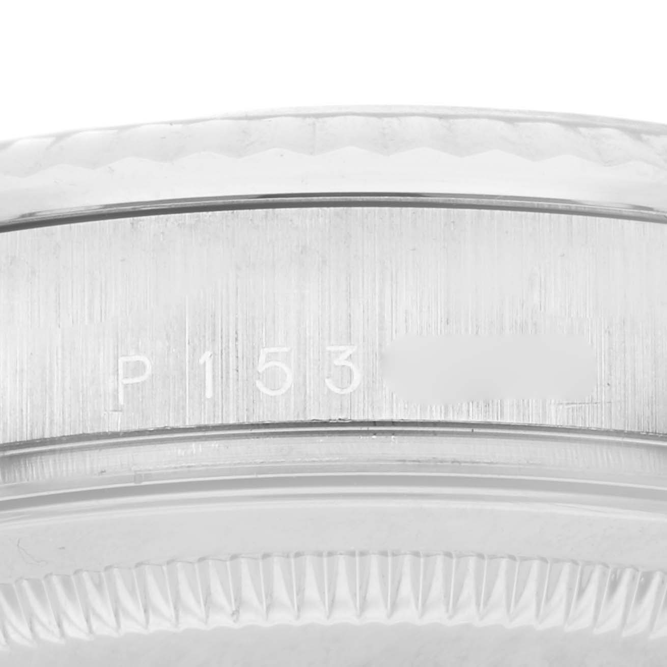 The image shows a close-up view of the serial number on the case back side of a Rolex President 118239 Men's White Gold Silver Dial 118239 Men's White Gold Silver Dial model watch.