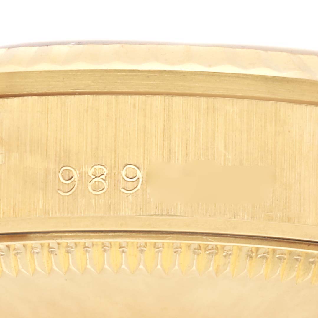 The image shows a close-up of the engraved edge and bezel of a Rolex President 68278 Women's Yellow Gold Champagne Dial 68278 Women's Yellow Gold Champagne Dial model watch.