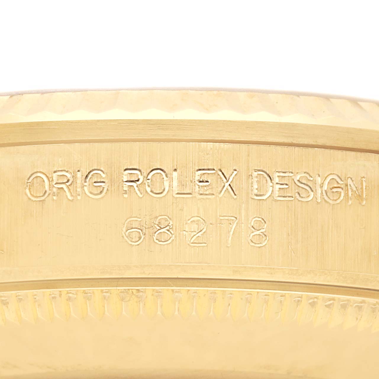 The image shows a close-up of the Rolex President 68278 Women's Yellow Gold Champagne Dial 68278 Women's Yellow Gold Champagne Dial watch’s side, featuring its model and design engraving.