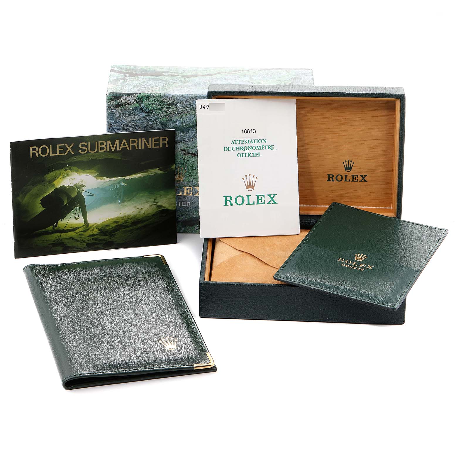 The image shows the packaging and documentation set for a Rolex Submariner 16613 Men's Steel and Gold (two tone) Blue Dial 16613 Men's Steel and Gold (two tone) Blue Dial, including the box, manuals, and warranty card holder.