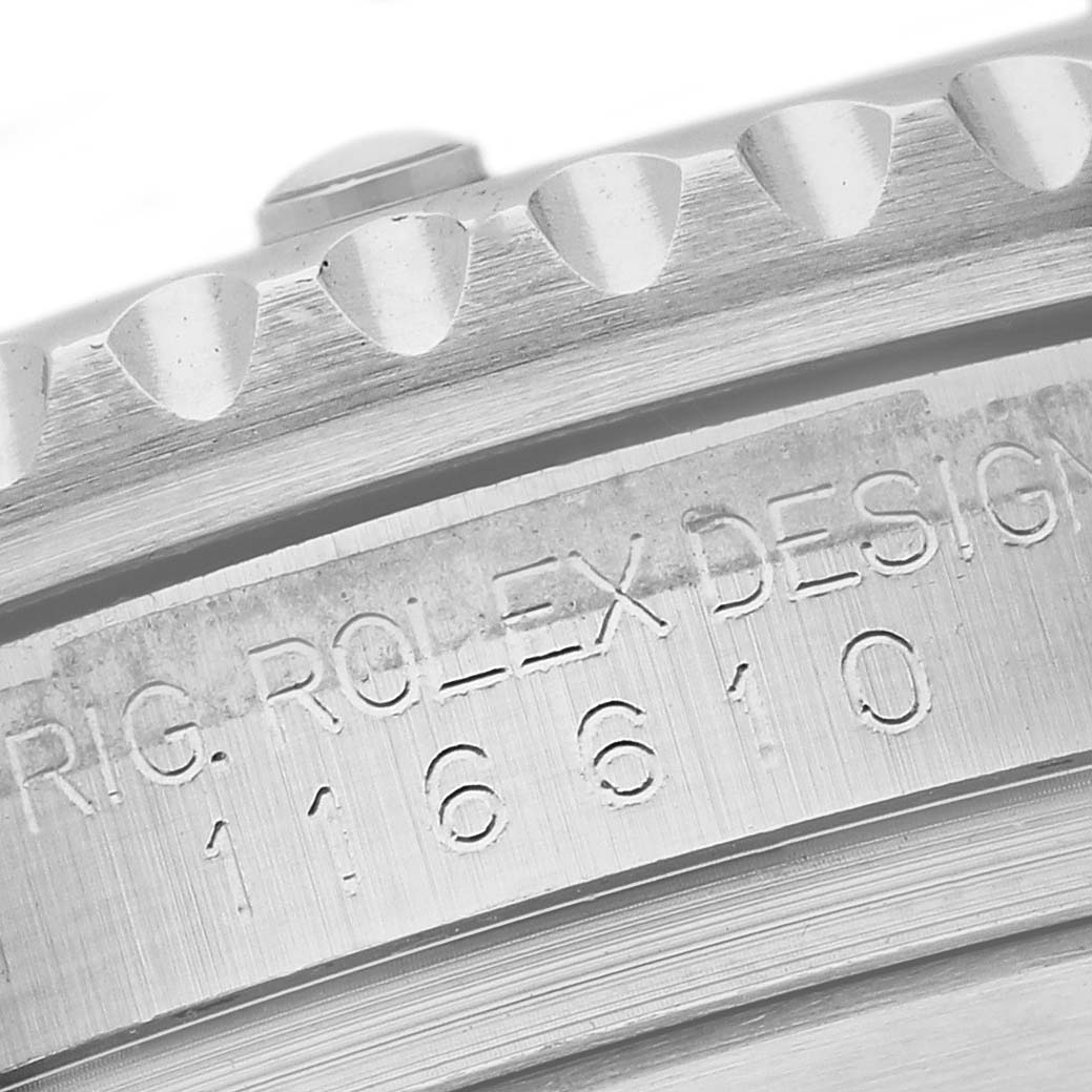 The image shows a close-up of the edge of the bezel and engraved serial number on the Rolex Submariner 116610 Men
s Stainless Steel Black Dial 116610 Men
s Stainless Steel Black Dial watch.