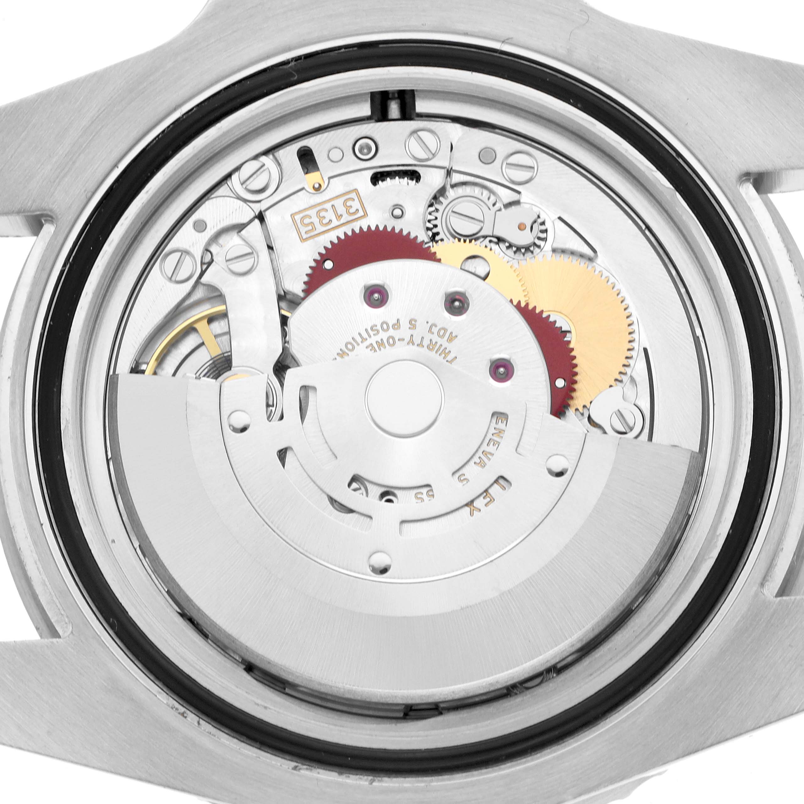 The image shows the backside view of a Rolex Submariner 116610LV Men
s Stainless Steel Green Dial watch, highlighting its intricate movement and gears.