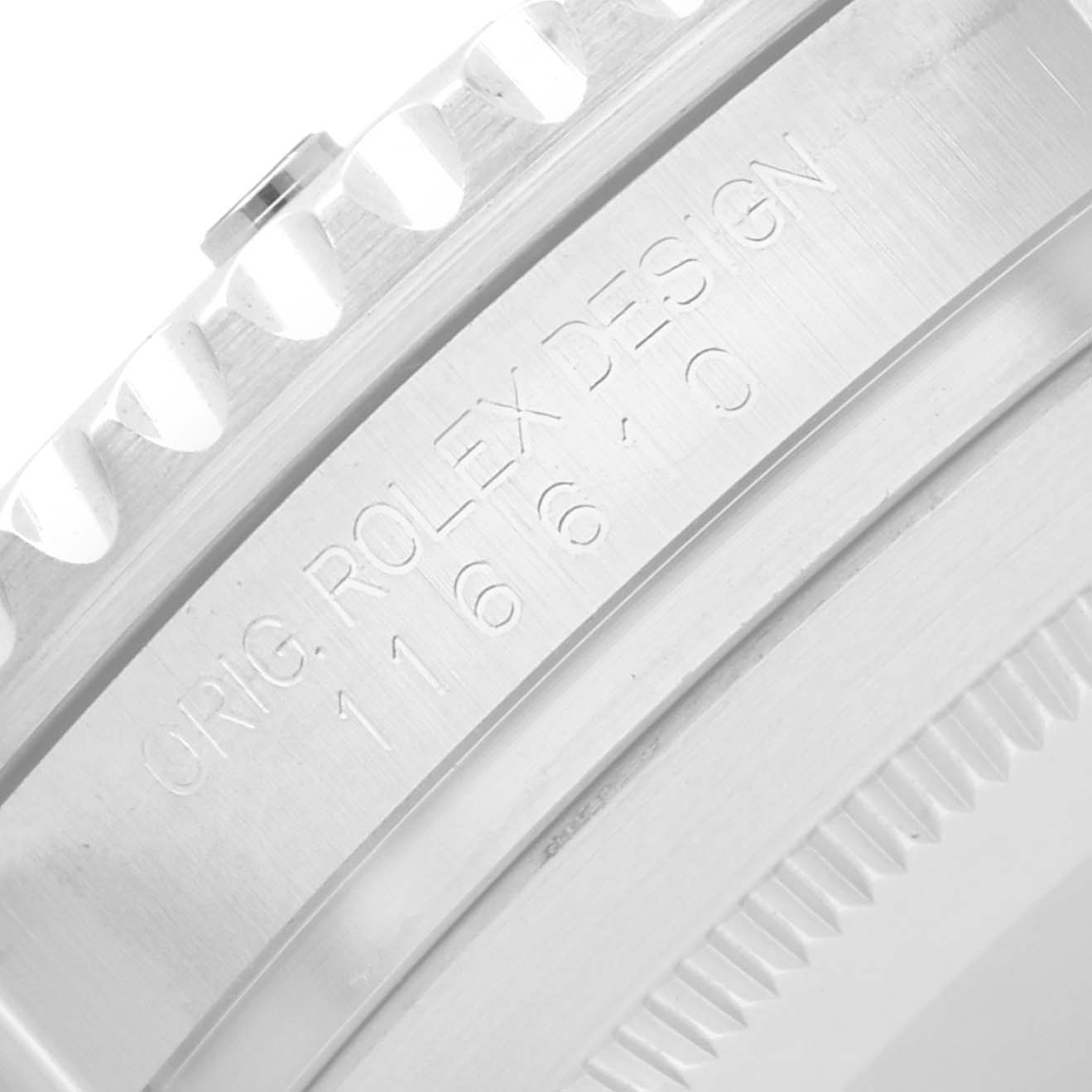 The image shows a close-up of the side of the bezel and engraving on a Rolex Submariner 116610LV Men
s Stainless Steel Green Dial watch case.