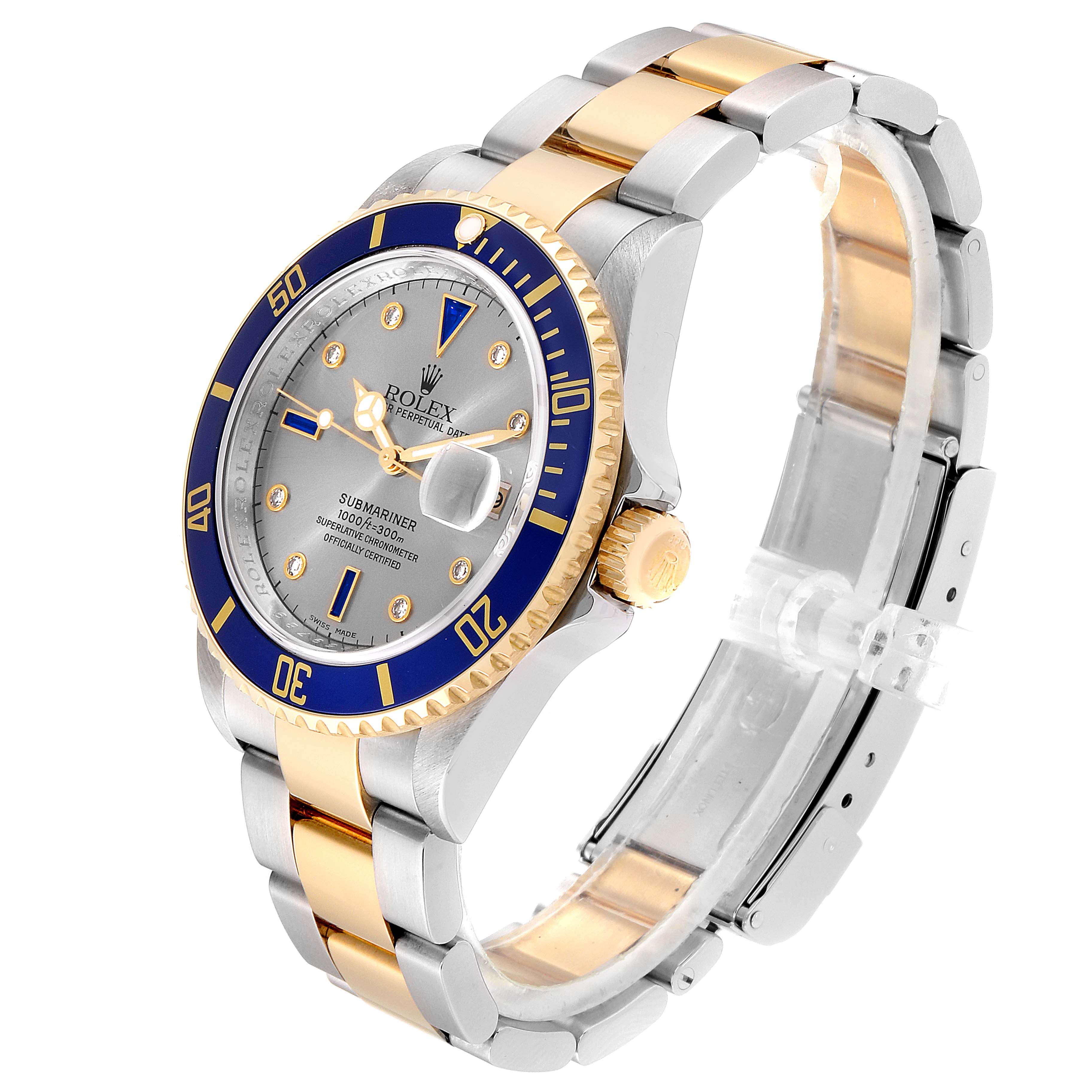 The image shows a three-quarter angle of a Rolex Submariner 16613 Men
s Steel and Gold (two tone) Grey Dial 16613 Men
s Steel and Gold (two tone) Grey Dial, displaying the face, bezel, crown, and bracelet.