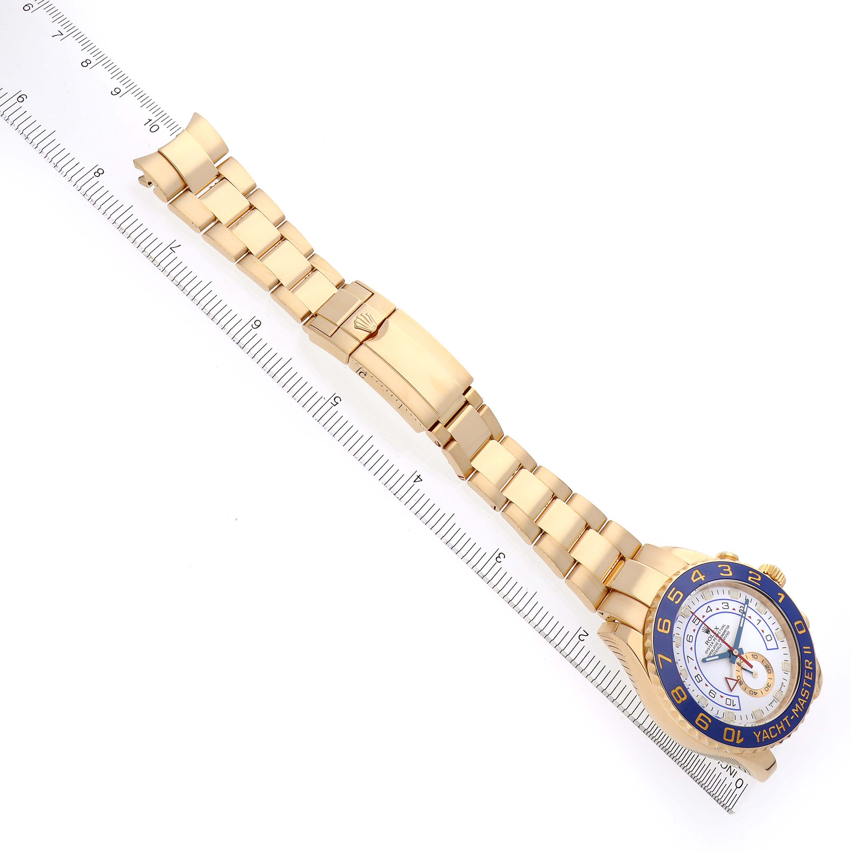 The Rolex Yacht-Master 116688 Men's Yellow Gold White Dial 116688 Men's Yellow Gold White Dial watch is shown from a top-down angle, highlighting the full bracelet, clasp, and face.