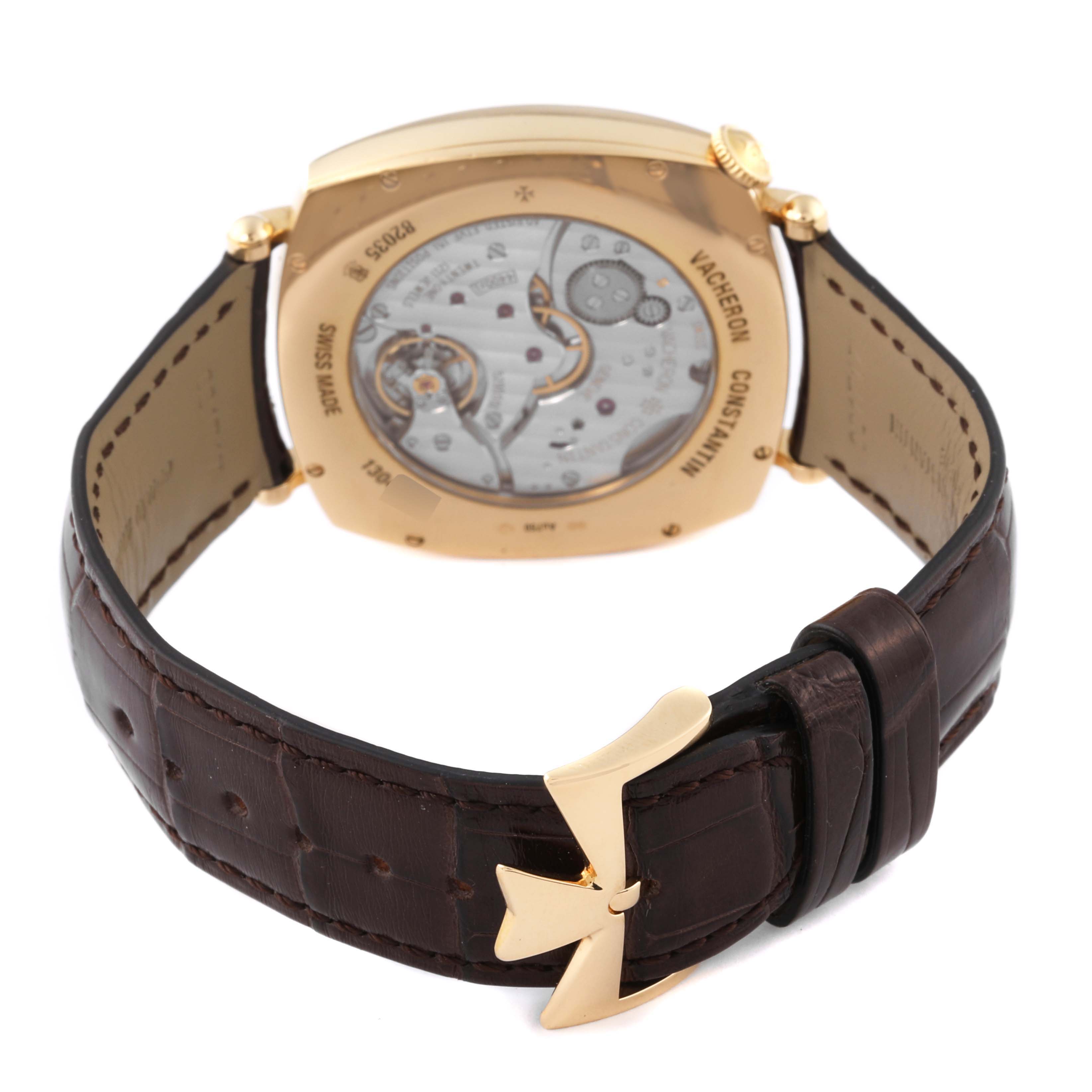 The image shows the back view of a Vacheron Constantin Historiques 82035-000J-9964 Men's Yellow Gold Silver Dial 82035-000J-9964 Men's Yellow Gold Silver Dial watch with its leather strap and mechanical movement visible.