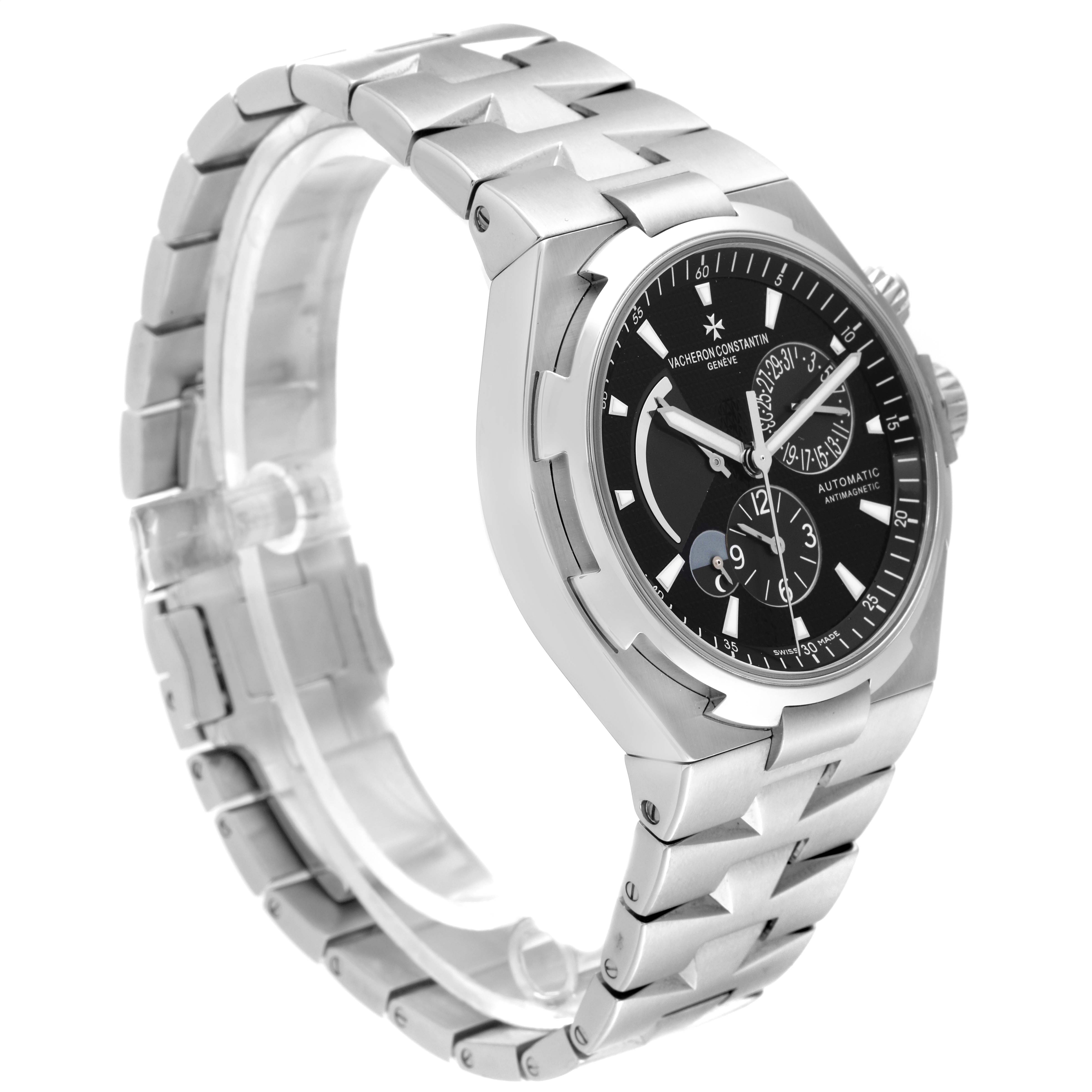 This image shows a Vacheron Constantin Overseas 47450/B01A-9227 Men's Stainless Steel Black Dial 47450/B01A-9227 Men's Stainless Steel Black Dial model watch at a three-quarter angle, highlighting its bracelet and dial.