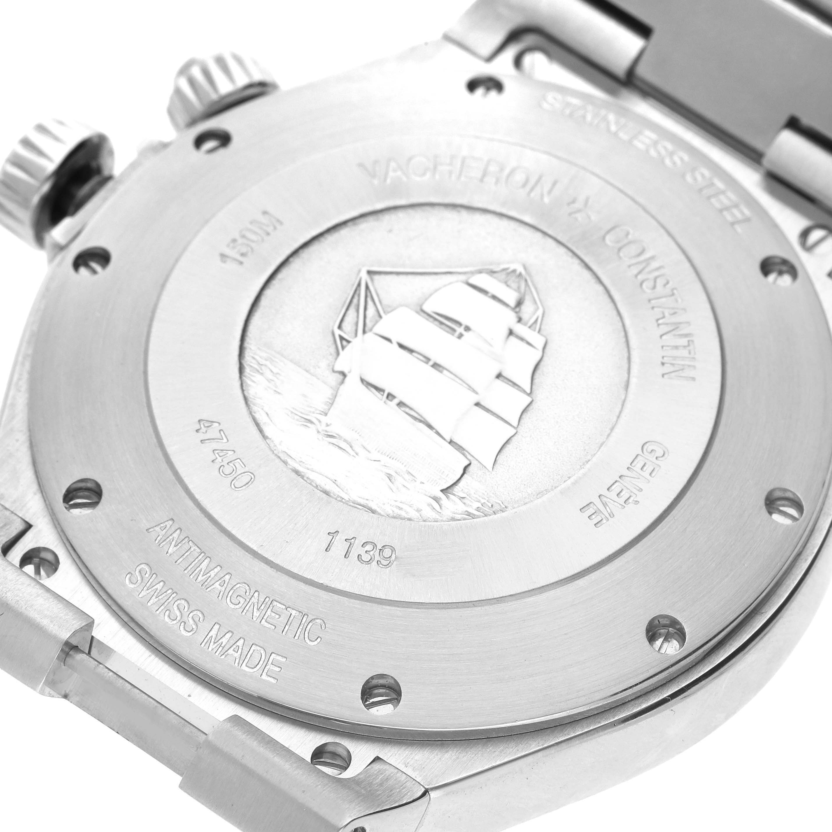 This image shows the case back of the Vacheron Constantin Overseas 47450/B01A-9227 Men's Stainless Steel Black Dial 47450/B01A-9227 Men's Stainless Steel Black Dial watch, featuring engravings and a ship design.