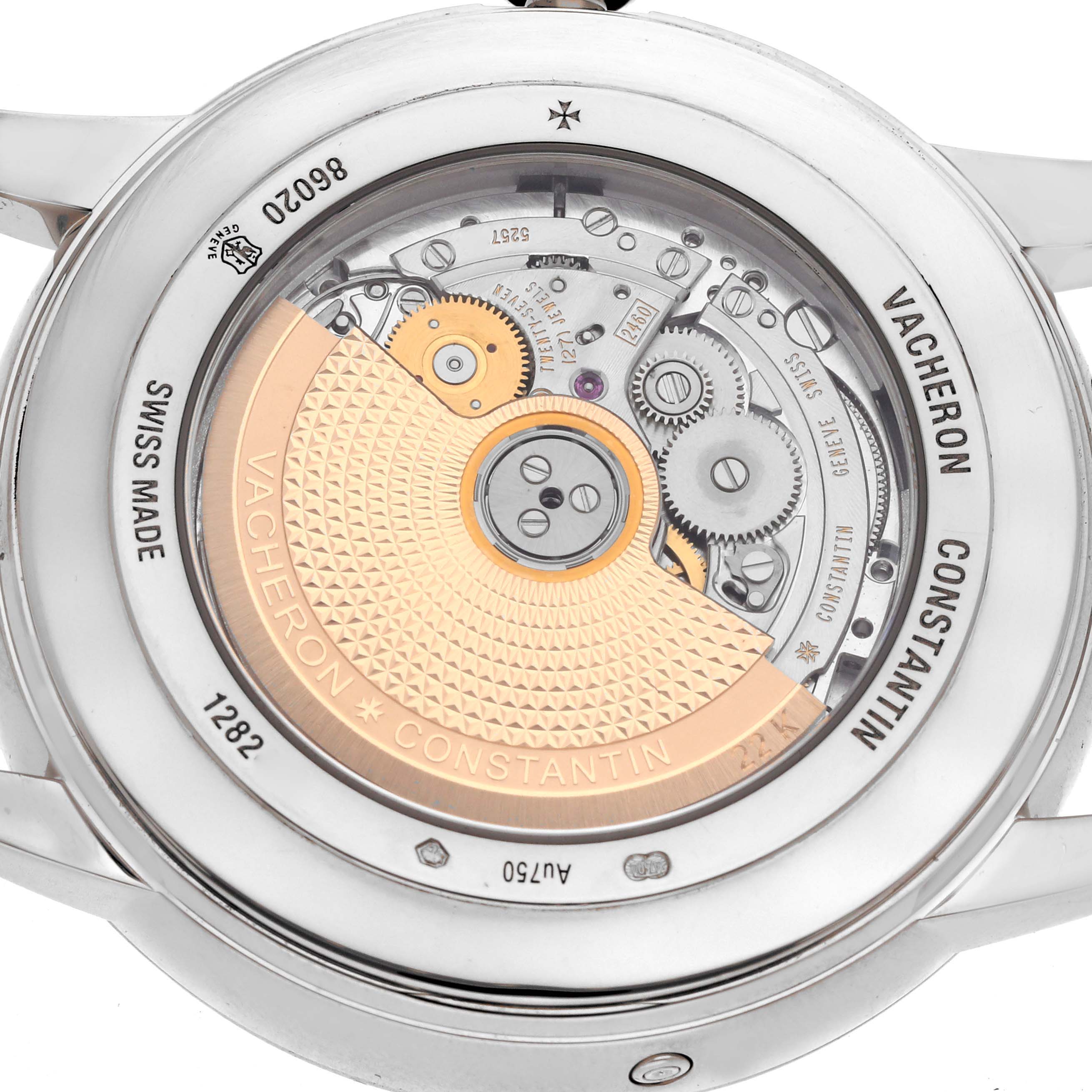 The image shows the back of the Vacheron Constantin Patrimony 86020 Men
s White Gold Silver Dial watch, highlighting its intricate movement and rotor.
