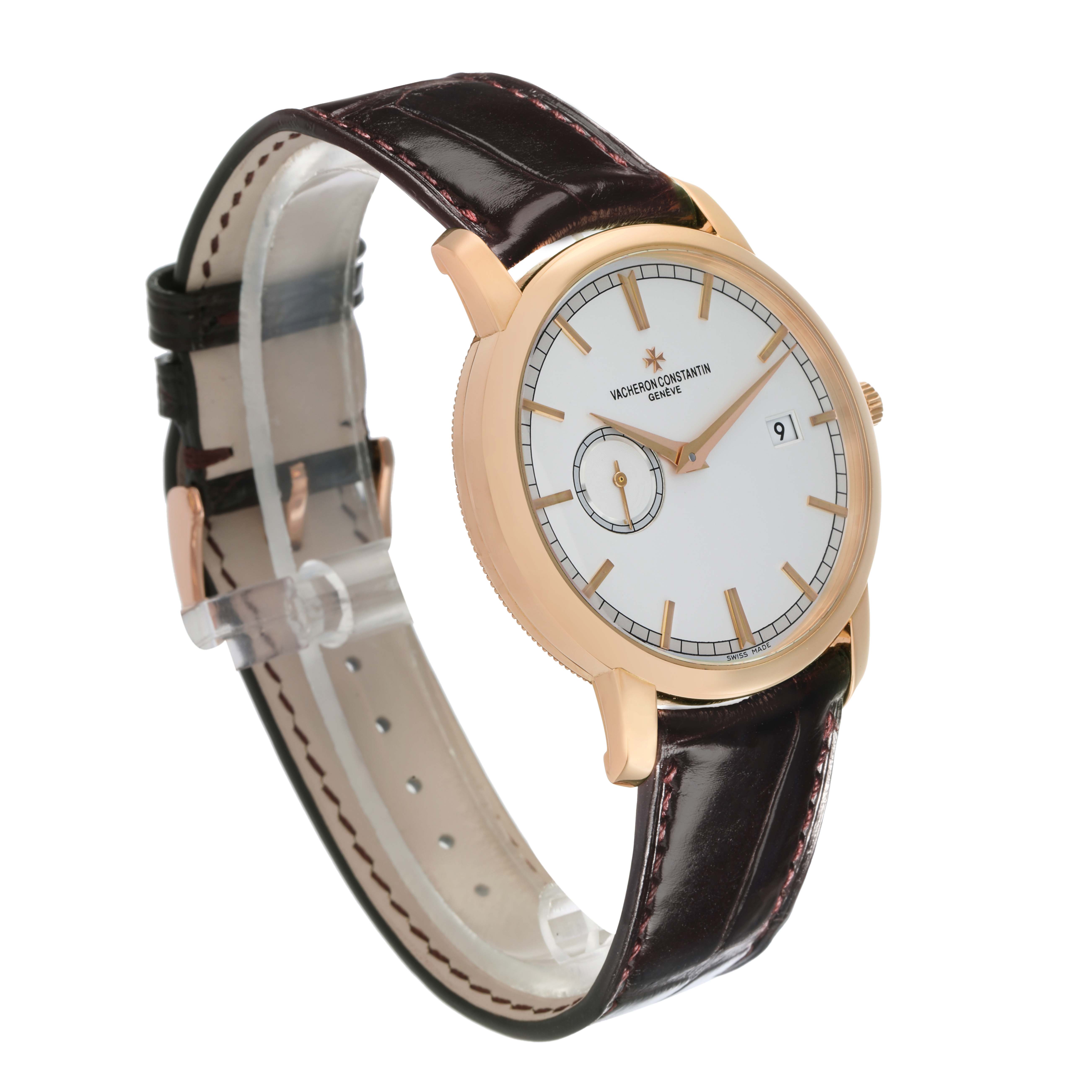 The Vacheron Constantin Traditionnelle 87172/000R-9302 Men
s Rose Gold Silver Dial watch is shown at a three-quarter angle, highlighting its face, gold casing, and brown leather strap.