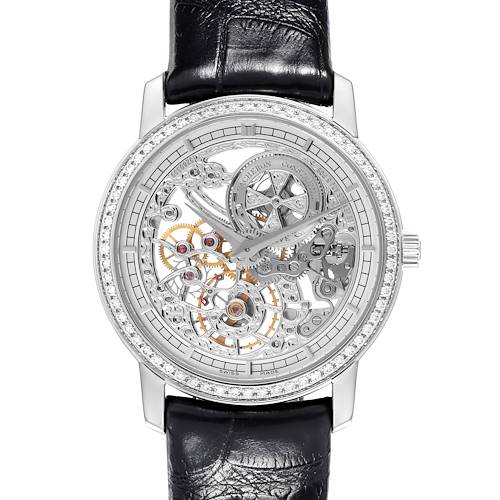 The Vacheron Constantin Traditionnelle watch is shown from a top-down angle, featuring a skeleton dial and black leather strap.