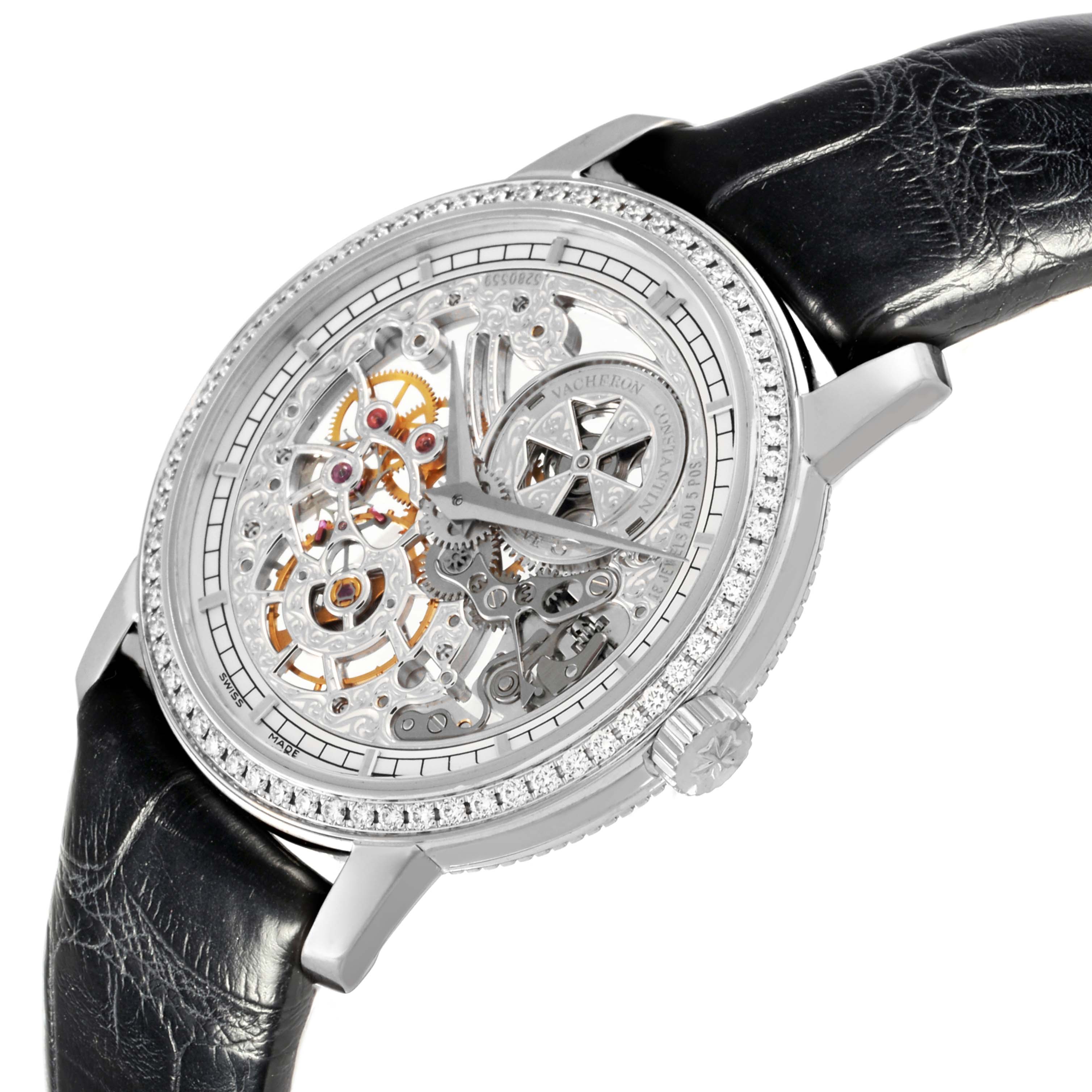 The image shows a Vacheron Constantin Traditionnelle 33558/000G-9394 Women
s White Gold Silver Dial 33558/000G-9394 Women
s White Gold Silver Dial watch at a three-quarter angle, highlighting its skeleton dial, intricate gears, and black leather strap.