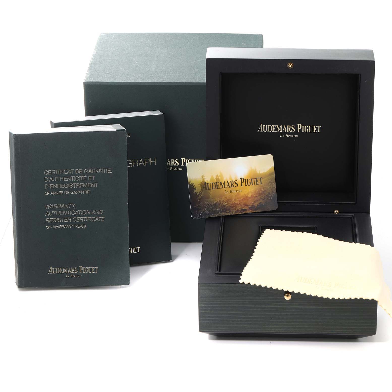 The image shows the box, certificates, cleaning cloth, and warranty card for an Audemars Piguet Royal Oak 26320ST.00.1220ST.01 Men's Stainless Steel Black Dial 26320ST.00.1220ST.01 Men's Stainless Steel Black Dial watch.