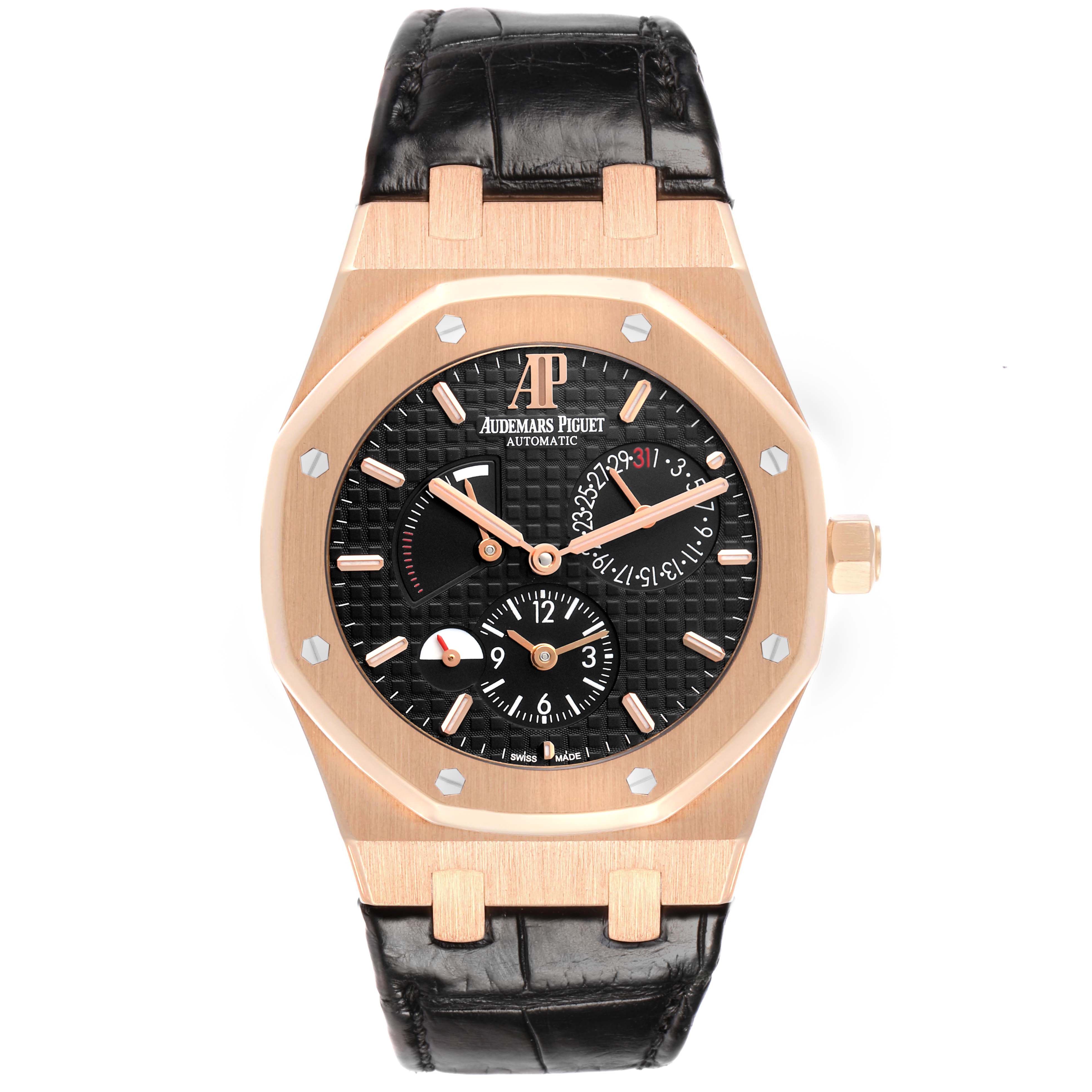 The Audemars Piguet Royal Oak 26120OR Men
s Rose Gold Black Dial watch is shown from the front, displaying its dial, bezel, crown, and leather strap.