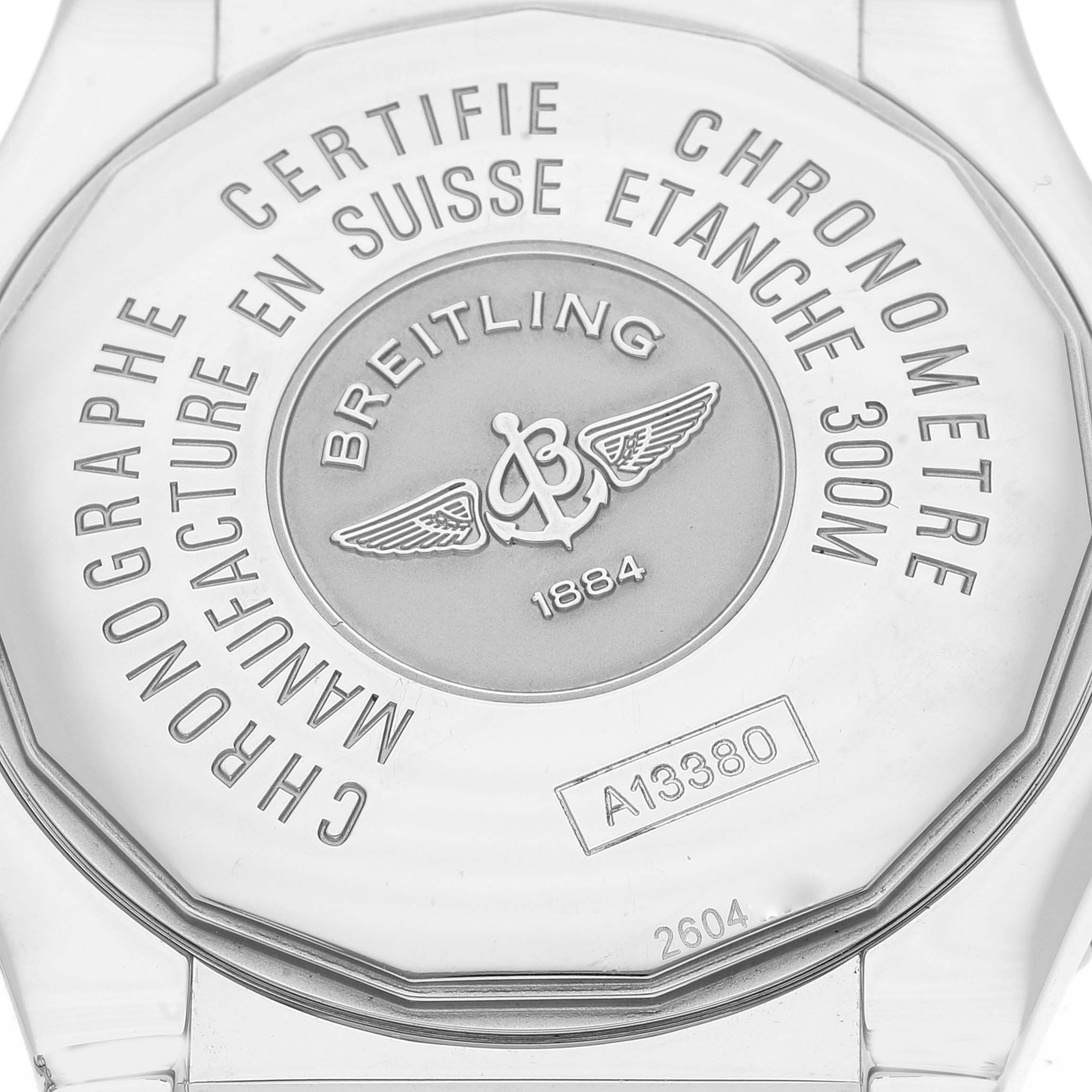 This image shows the back case of a Breitling Avenger A13380 Men's Stainless Steel Silver Dial A13380 Men's Stainless Steel Silver Dial watch, detailing its certifications and model number.