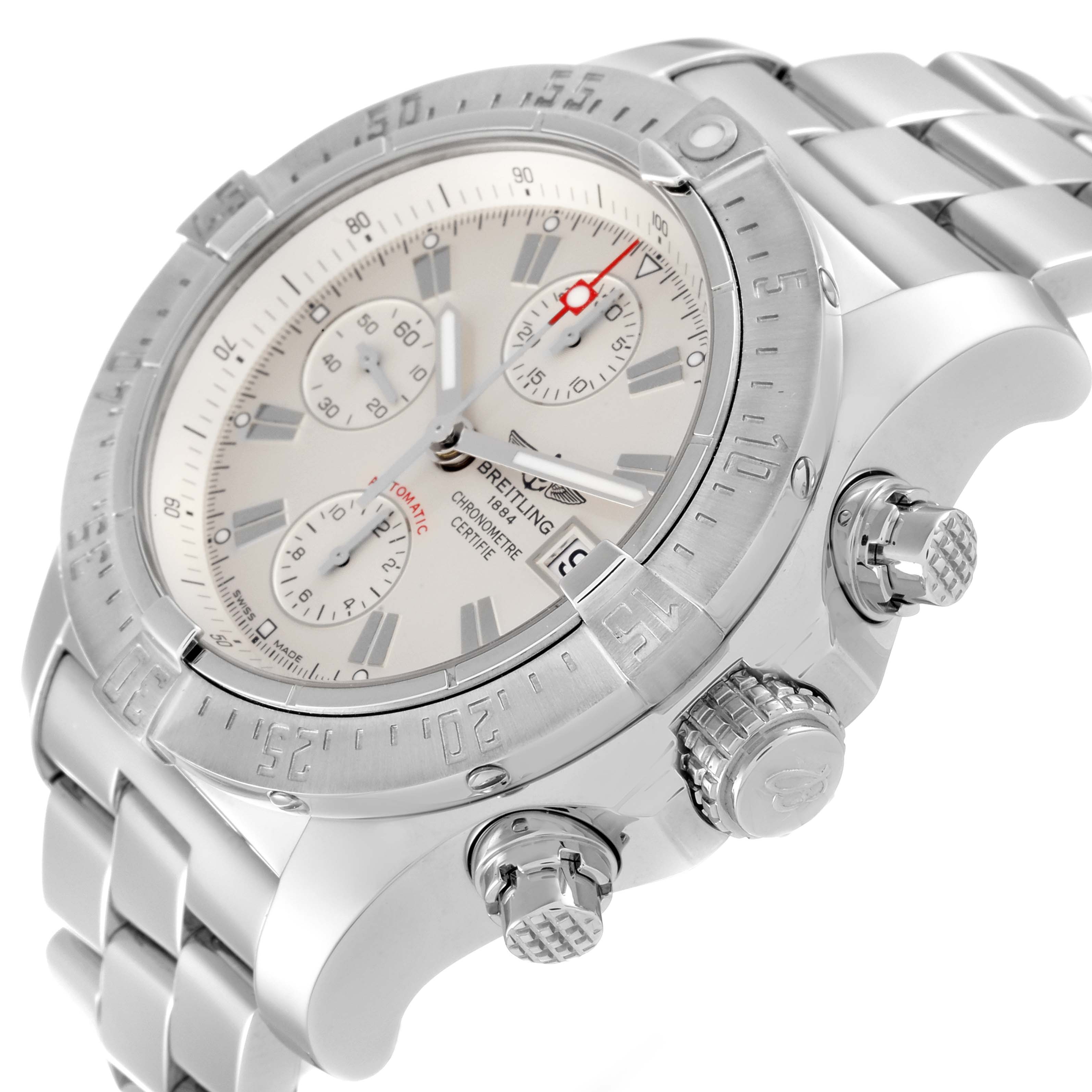 The image shows a side angle of the Avenger model by Breitling, displaying the crown, pushers, and part of the bracelet.