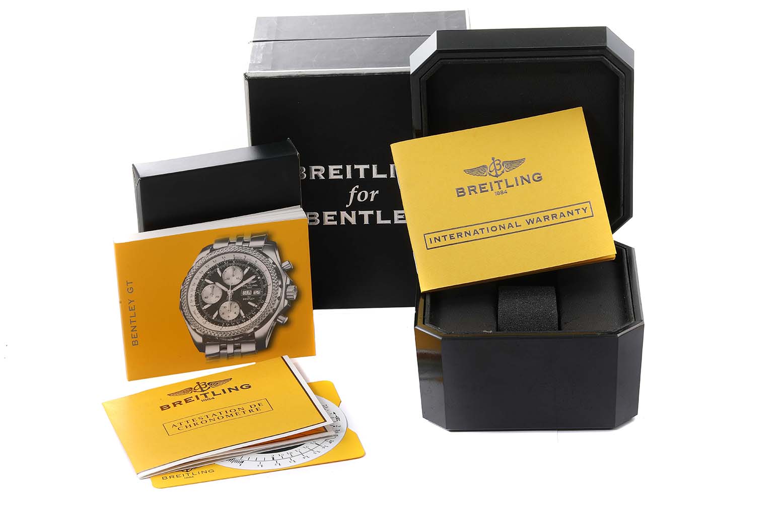 The image shows a Breitling Bentley A13362 Men's Stainless Steel Black Dial A13362 Men's Stainless Steel Black Dial watch packaging, manuals, international warranty, and a presentation box.