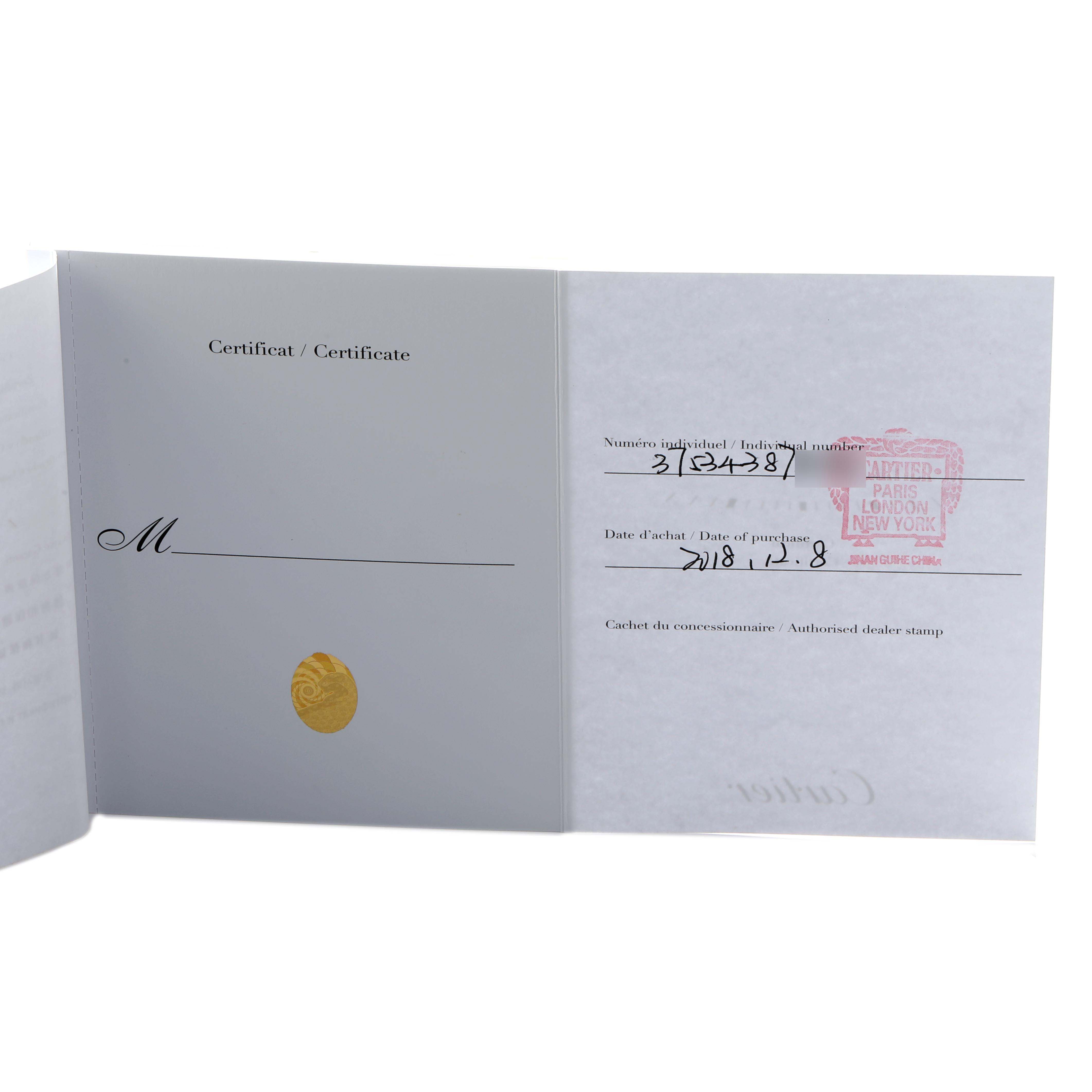 The image shows an open certificate booklet for a Cartier Ballon Bleu WE902077 Women's Steel and Gold (two tone) Silver Dial watch, displaying purchase details and a dealer stamp.