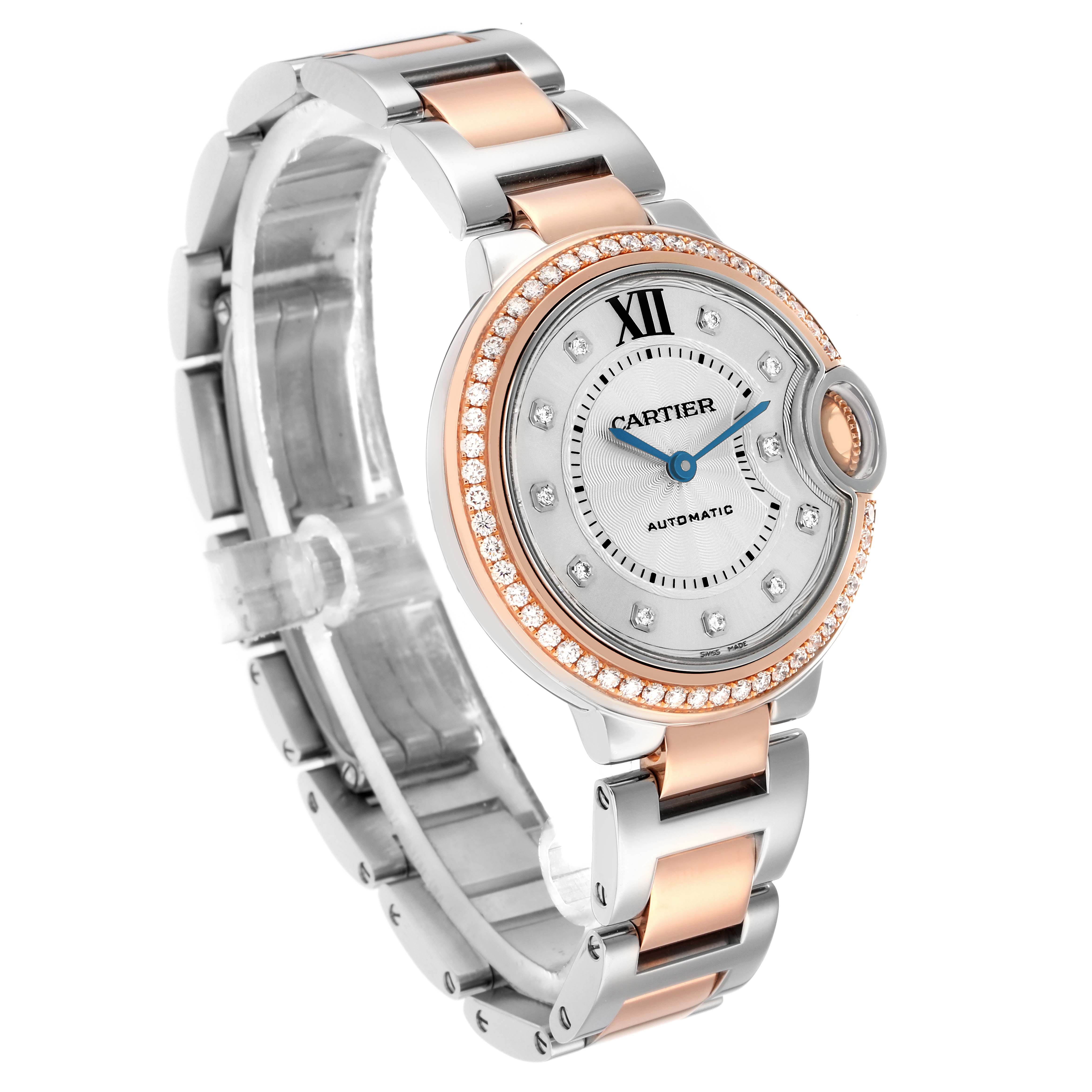 The Cartier Ballon Bleu WE902077 Women's Steel and Gold (two tone) Silver Dial watch is shown at an angle displaying the face, bezel, and part of the bracelet.